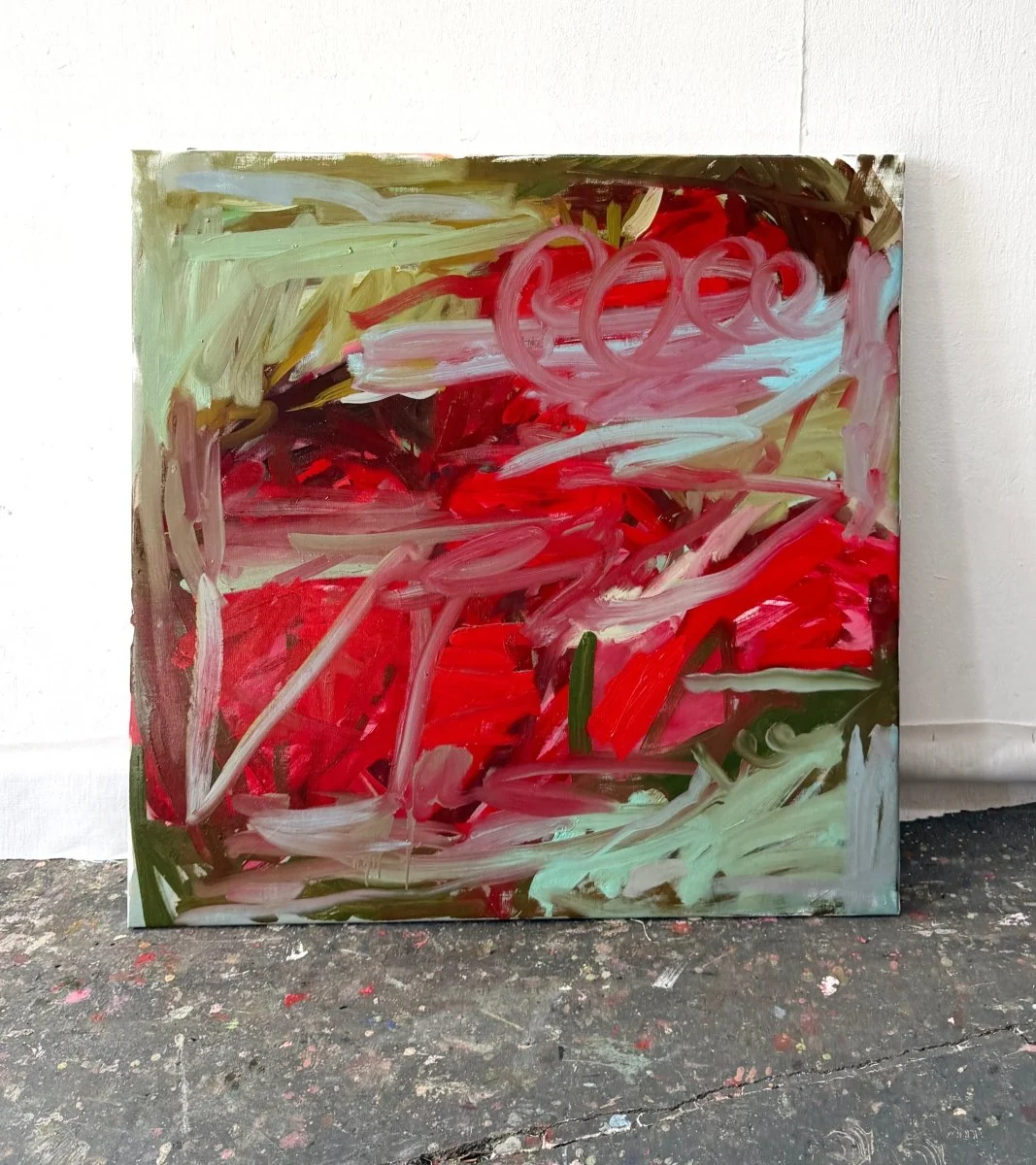 A vibrant abstract painting featuring bold reds and greens with expressive brushwork.