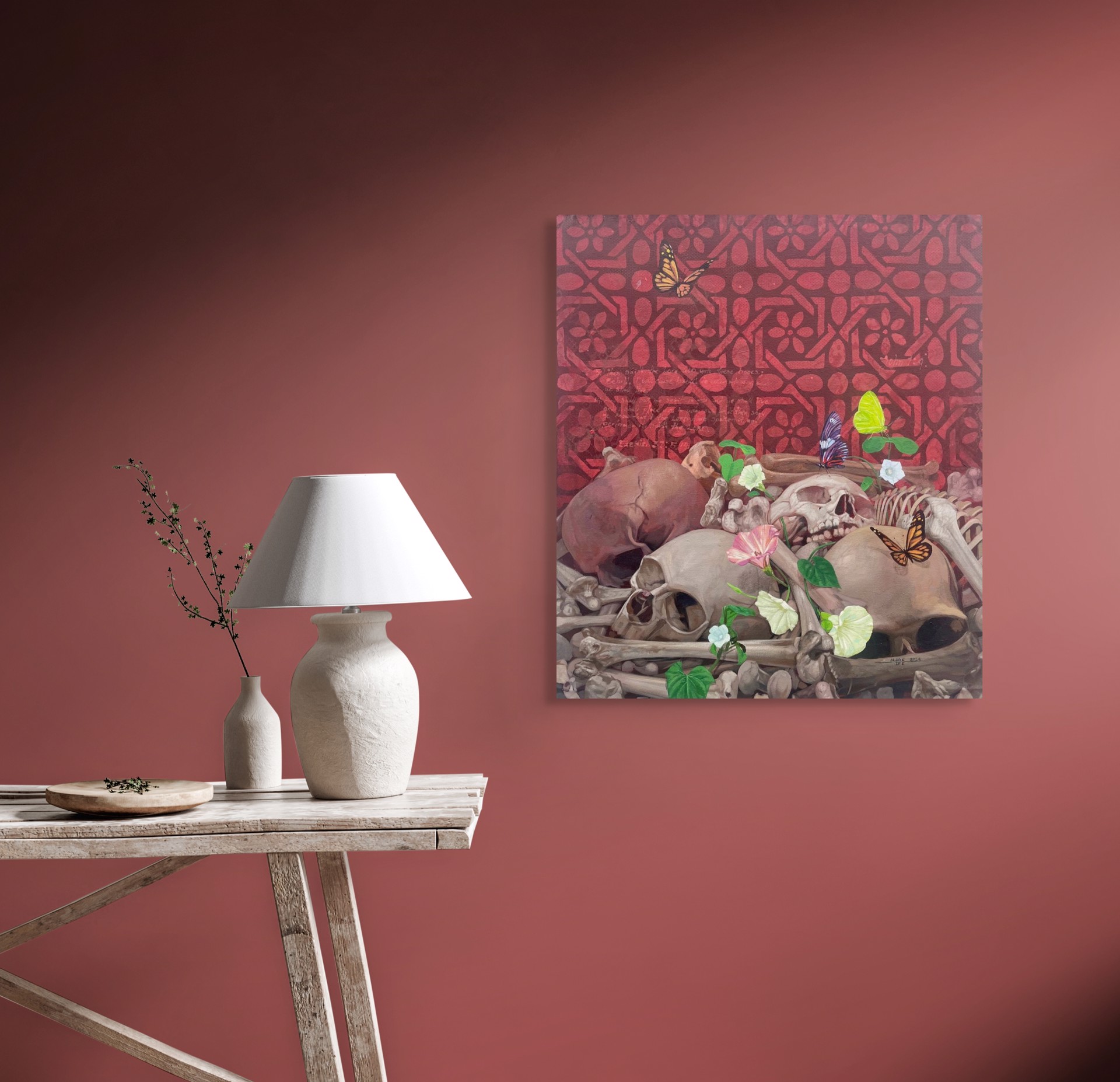 A painting of skulls and flowers with butterflies on them.