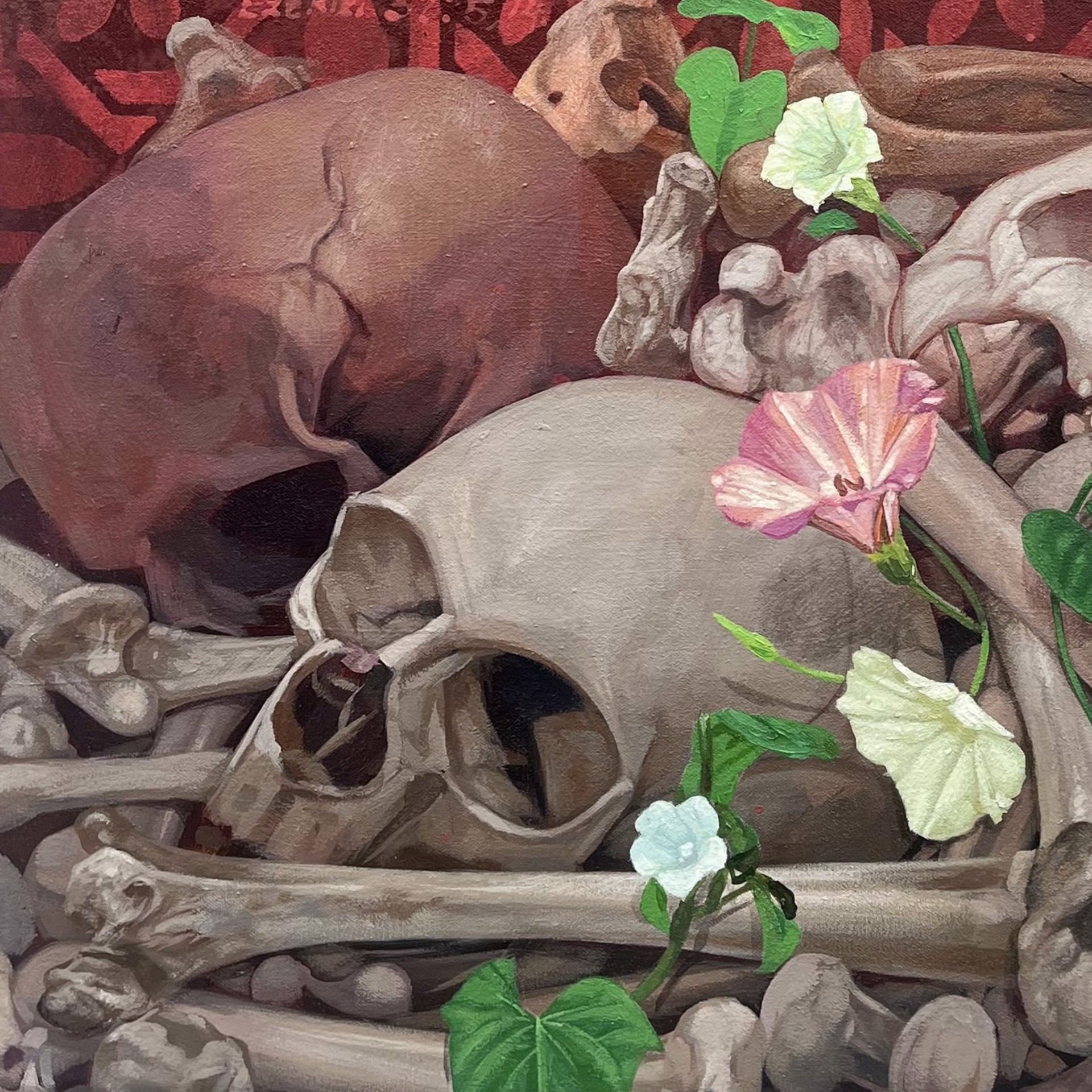 A painting of skulls and flowers with butterflies on them.