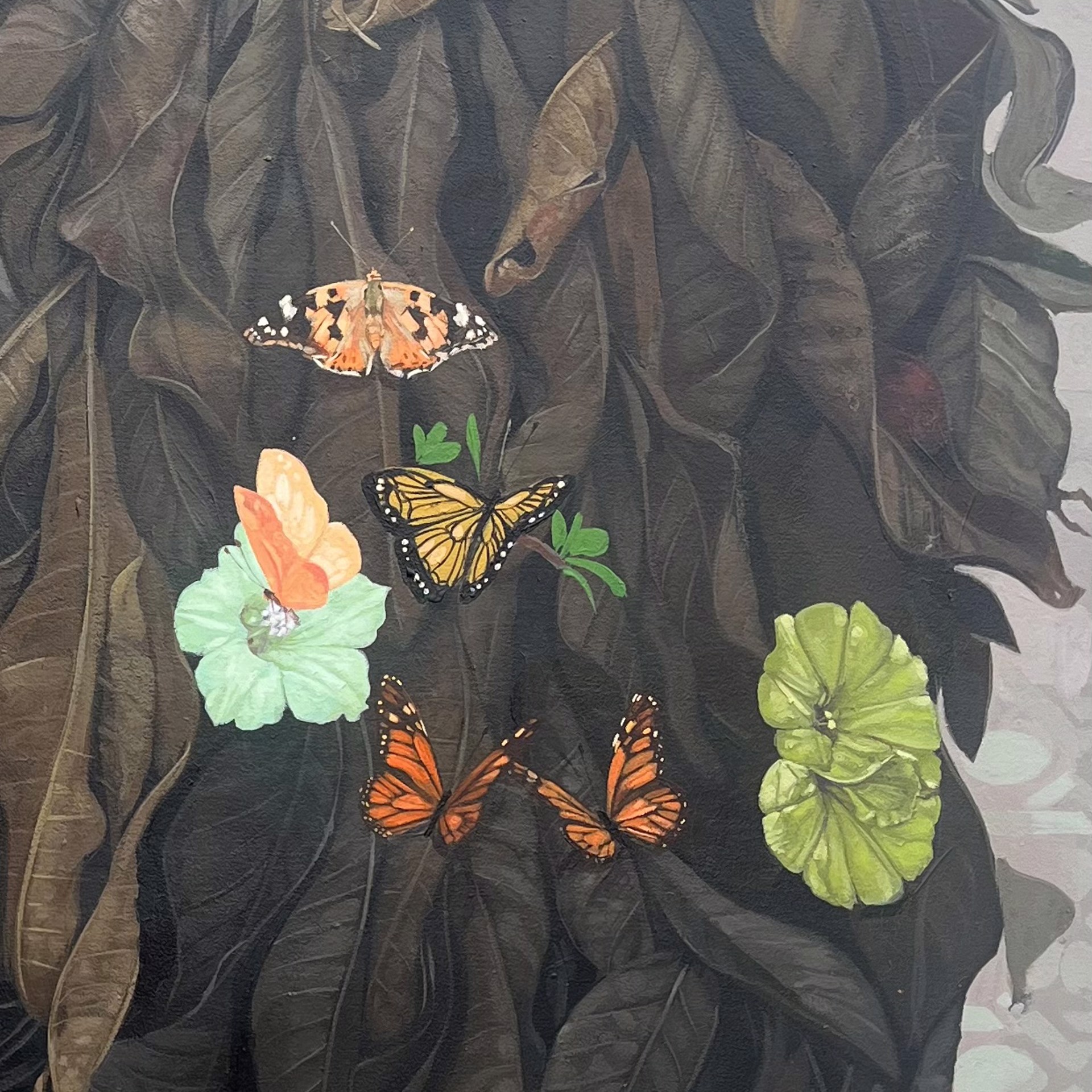 A painting of a woman with flowers and butterflies on her head.