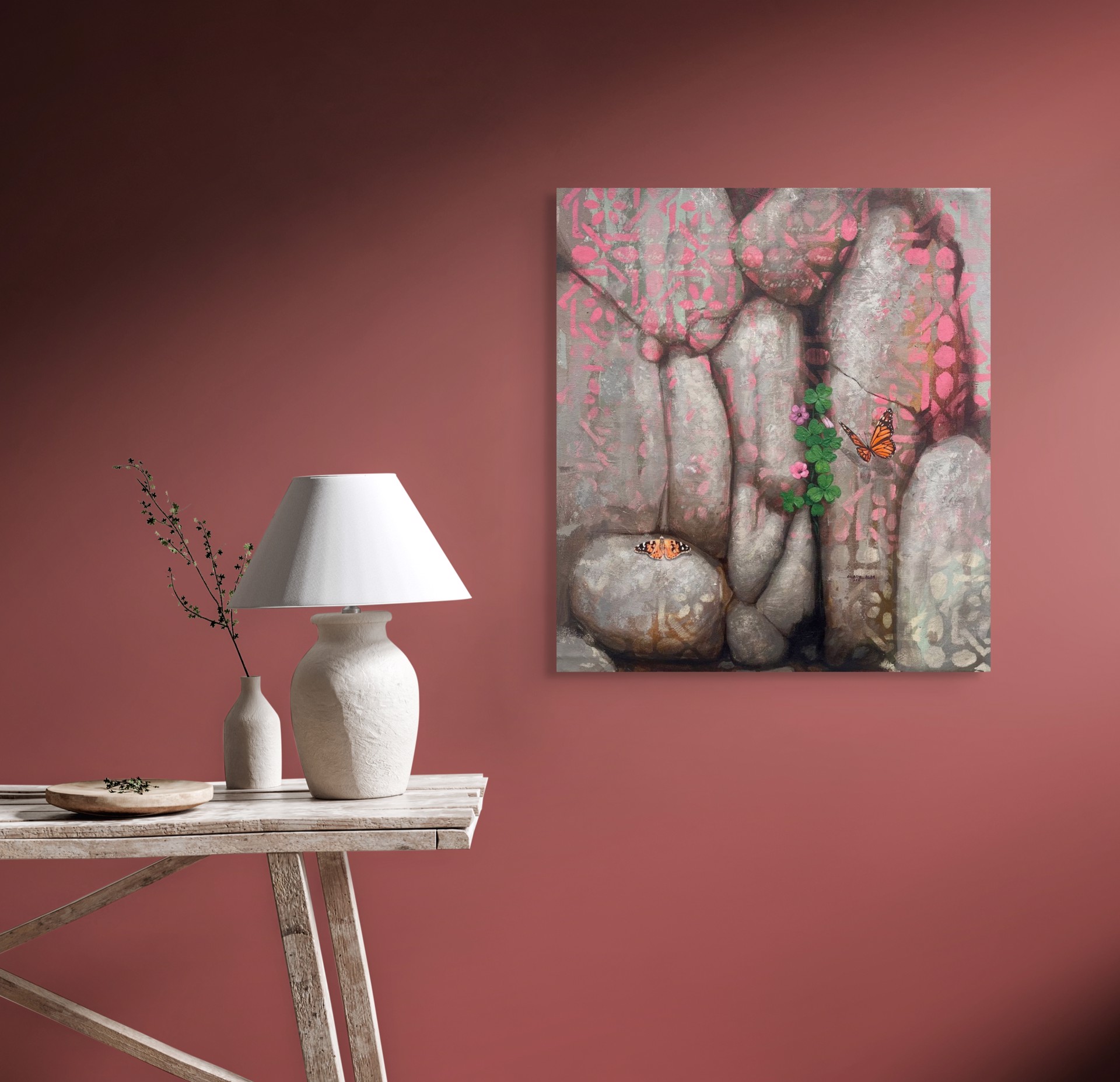A painting of two butterflies sitting on a rock wall.