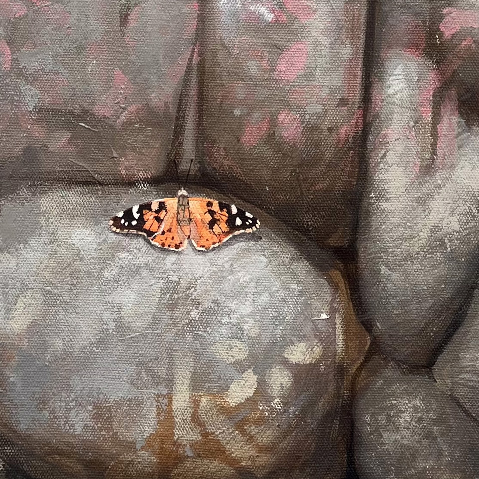 A painting of two butterflies sitting on a rock wall.