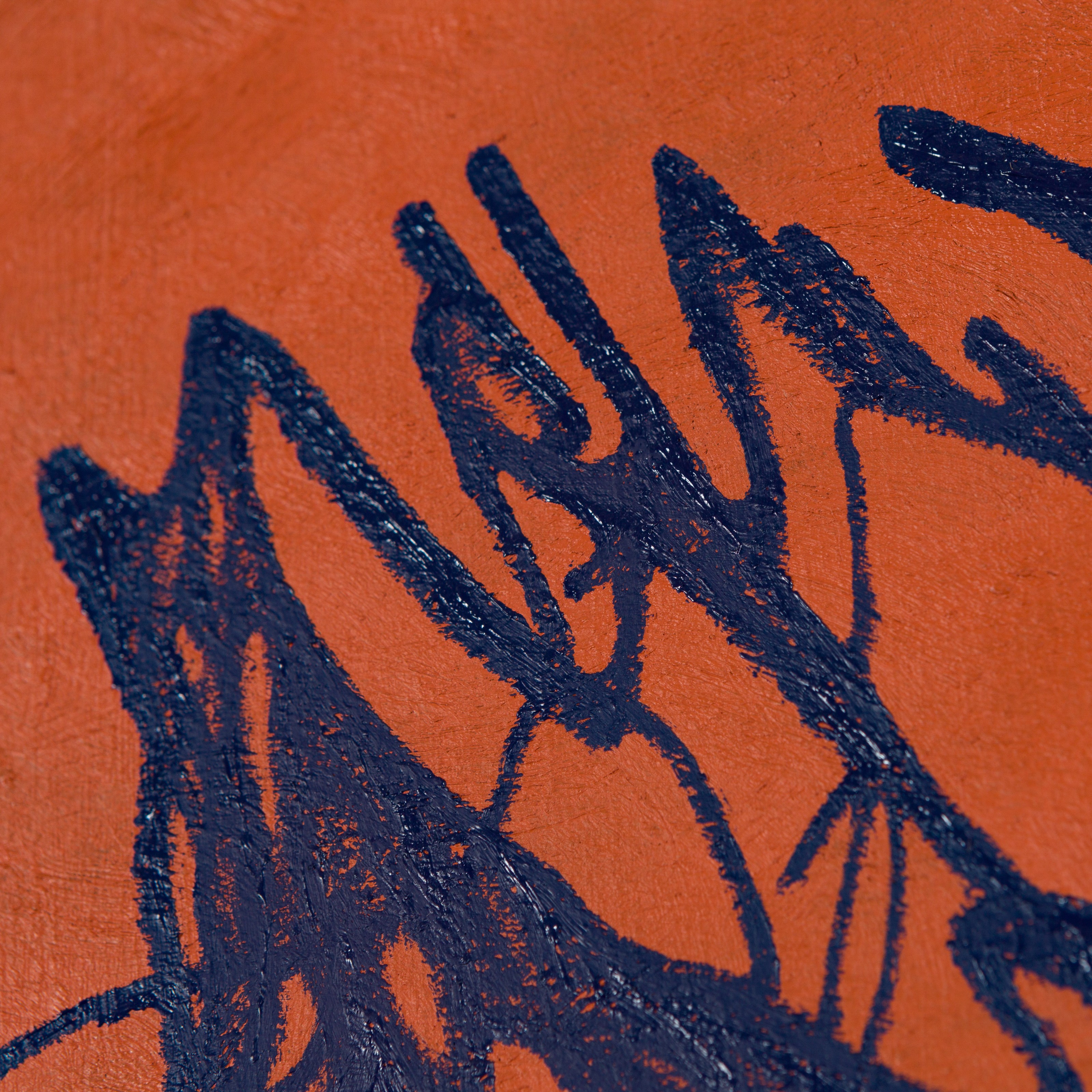 A bold abstract composition featuring dark blue jagged lines against a textured orange background.