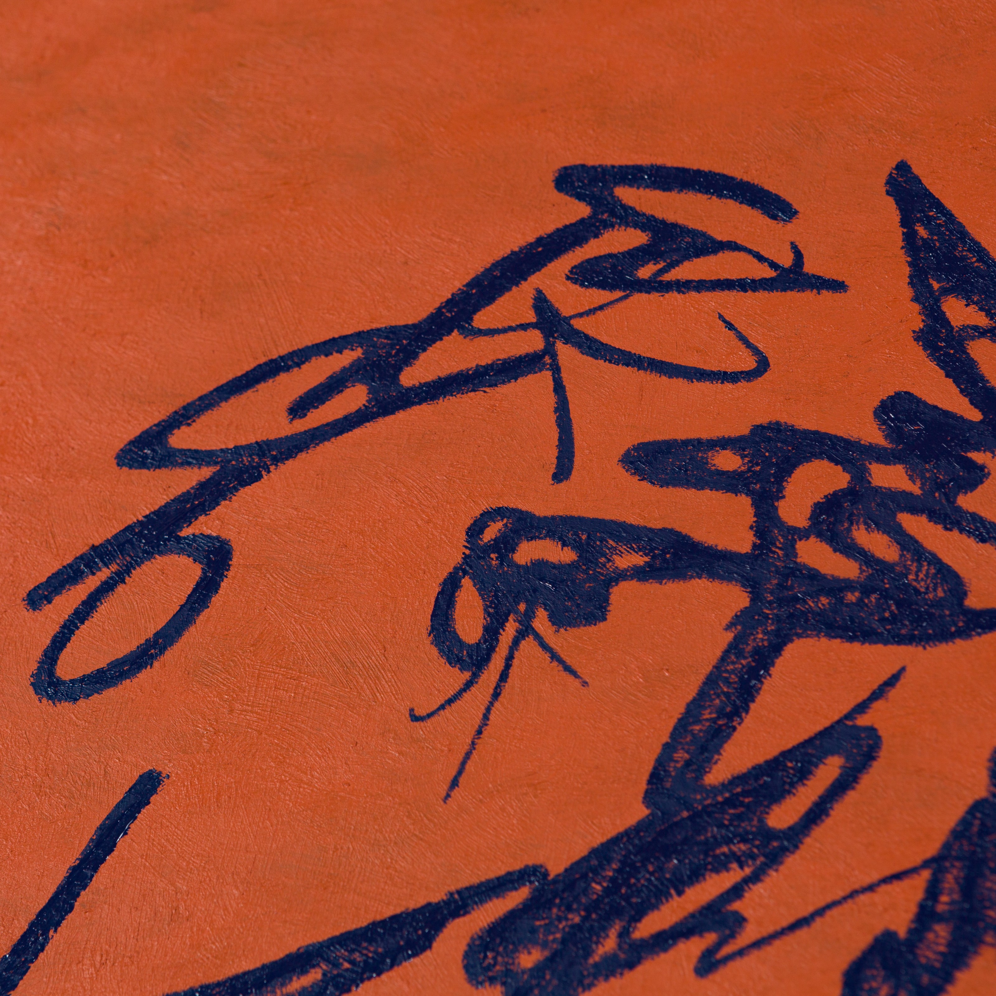 A bold abstract composition featuring dark blue jagged lines against a textured orange background.