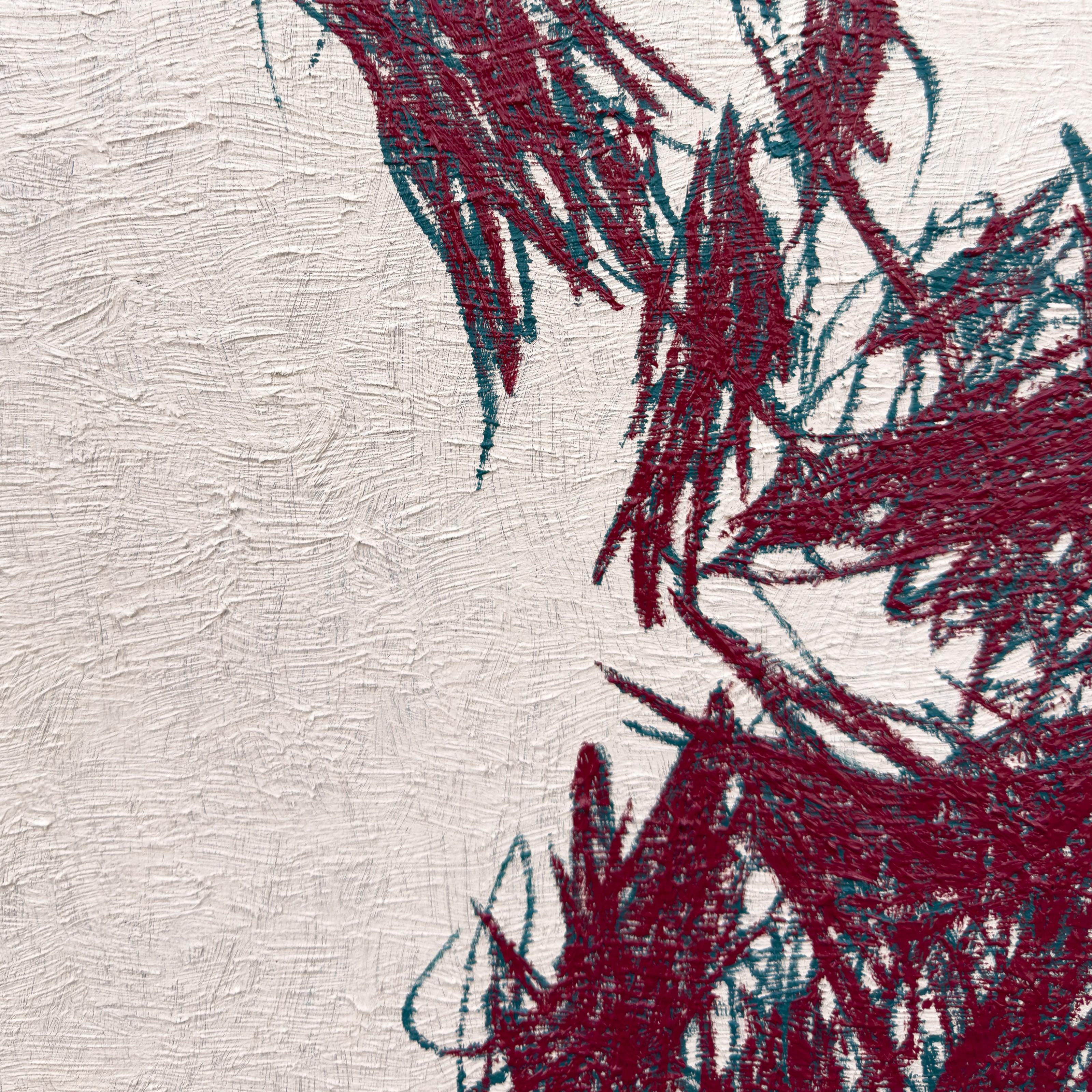 A close-up of a textured surface featuring bold, abstract brushstrokes in deep red and teal.