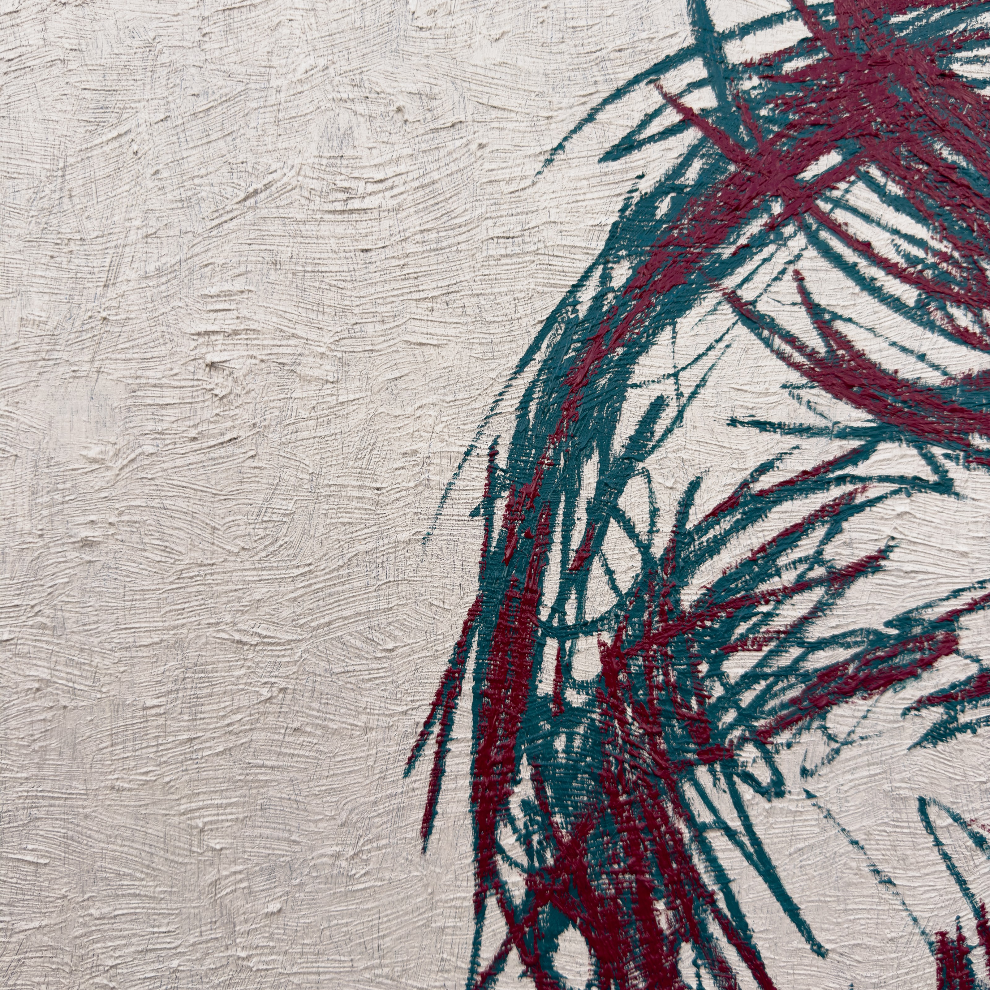 A close-up of a textured surface featuring bold, abstract brushstrokes in deep red and teal.