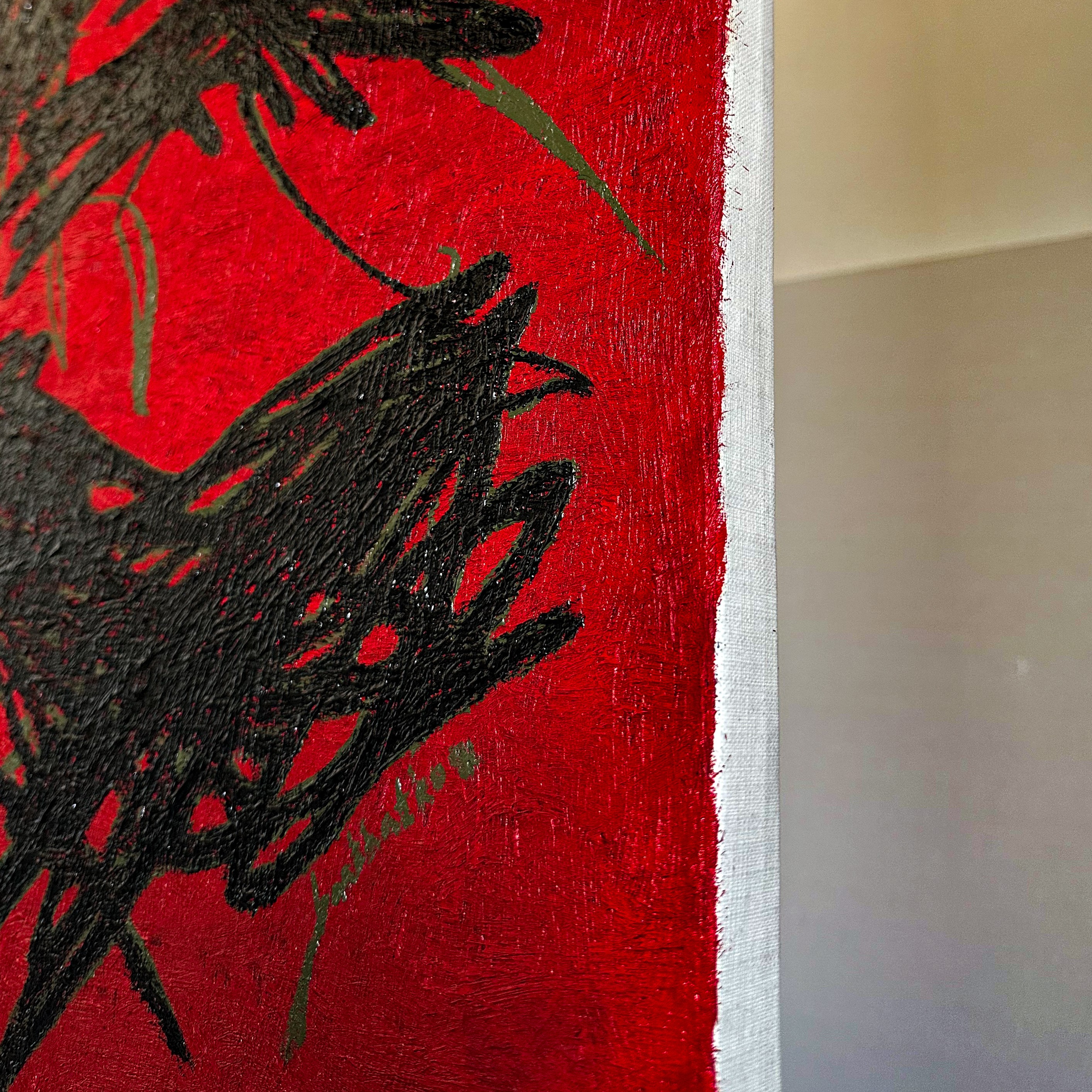 A close up of a painting on a red background.