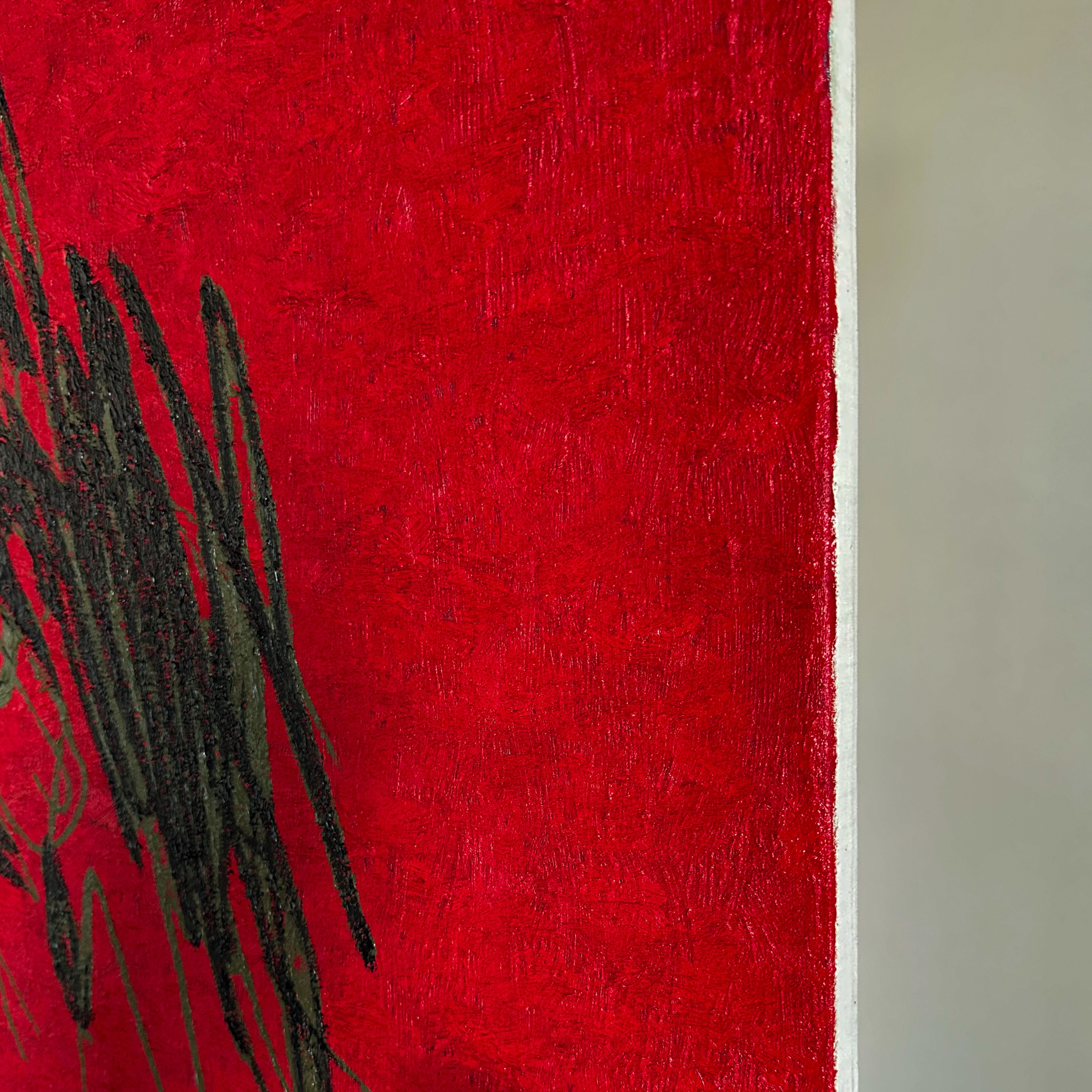 A close up of a painting on a red background.