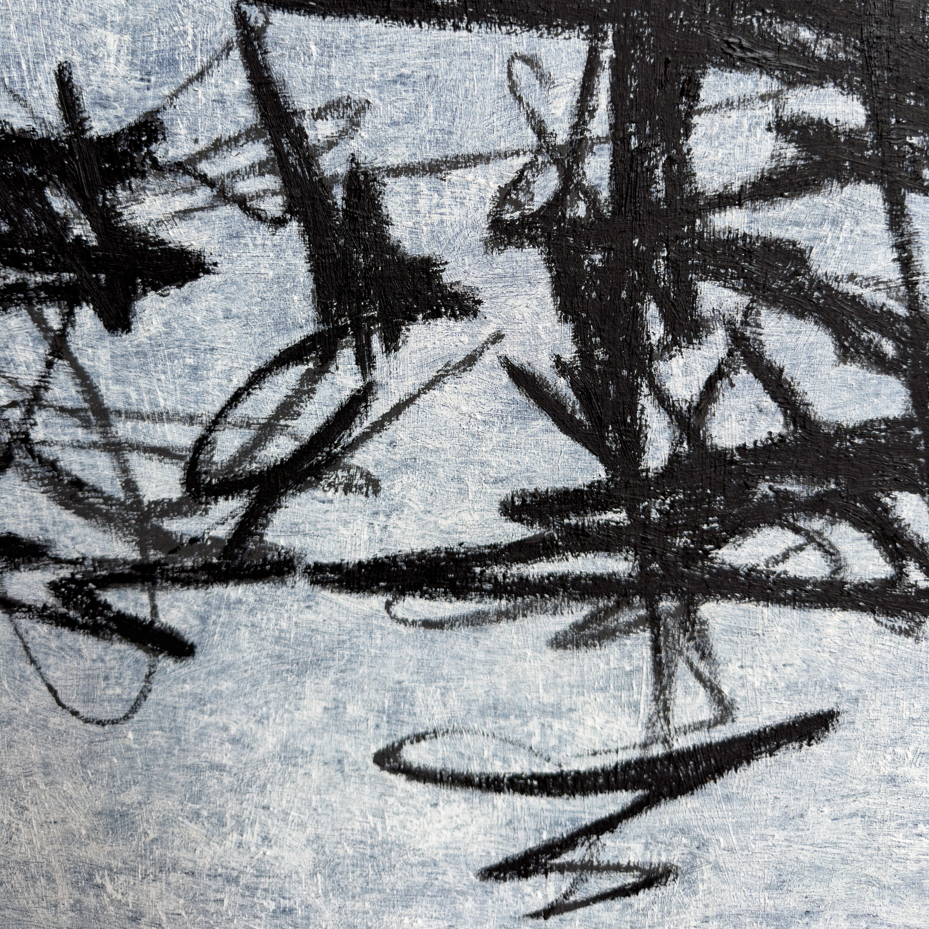 A monochromatic close-up of a textured, organic form resembling tangled roots or foliage.