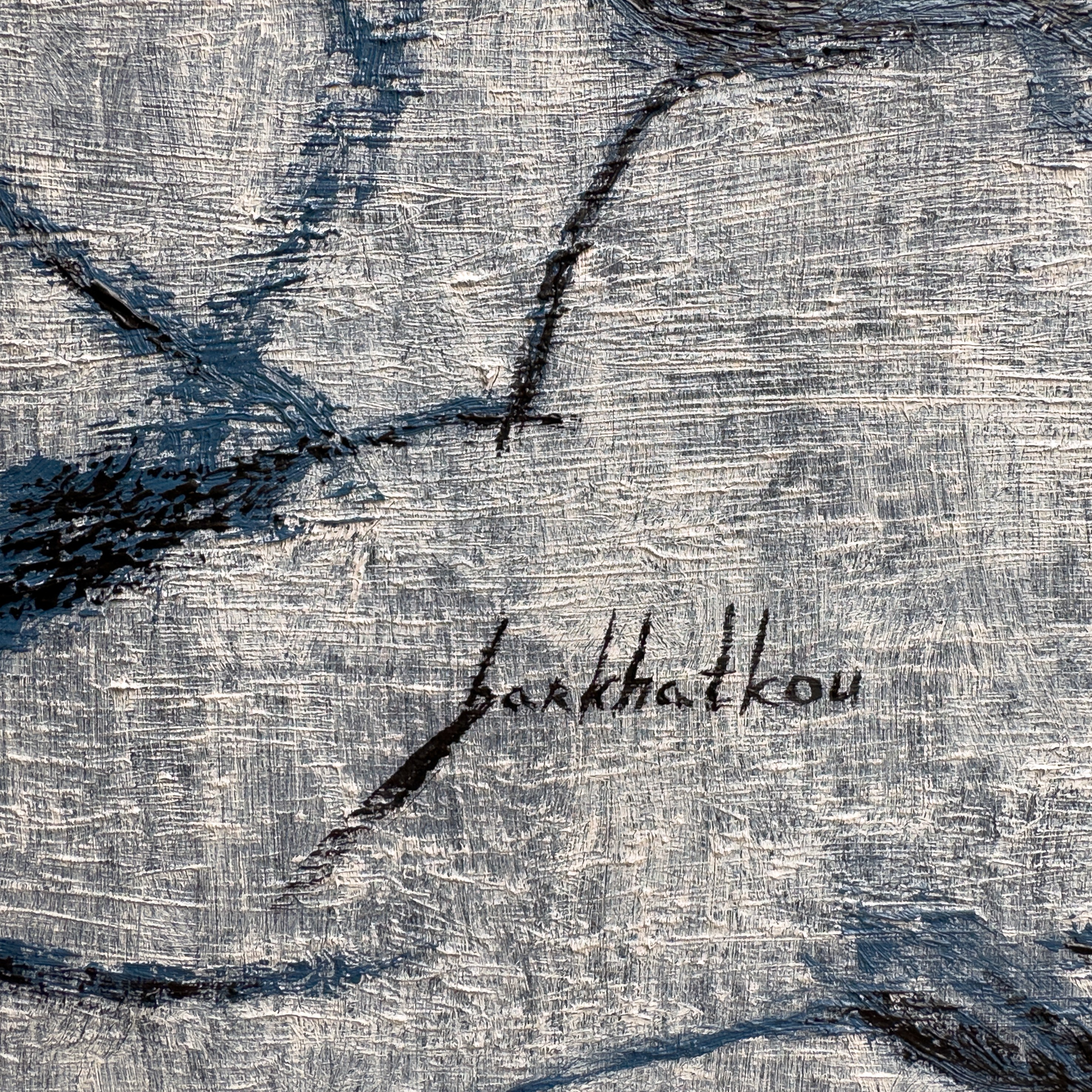 A textured close-up of a light surface marked by dark, organic lines and shadows.