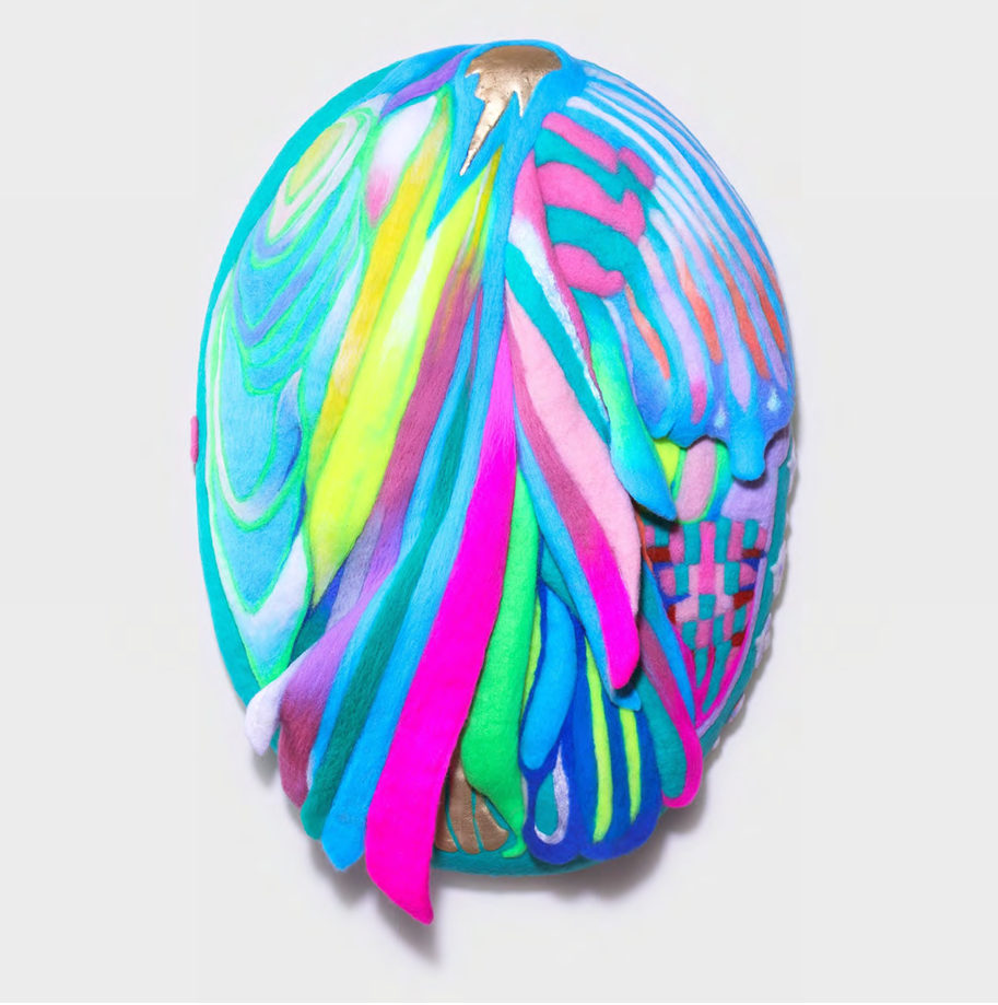 A colorful, multi-textured egg-shaped sculpture featuring vibrant felt strips and woven patterns.