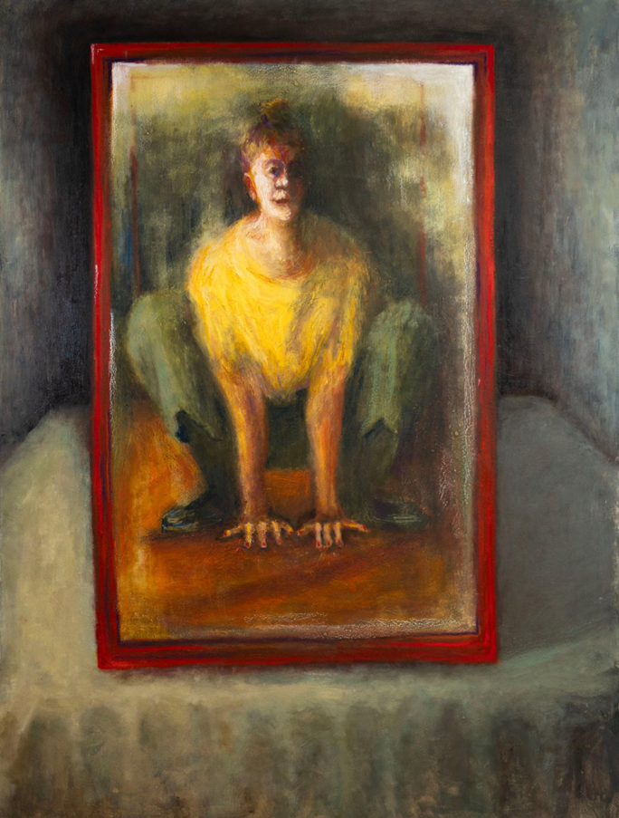 A framed portrait of a figure in a yellow shirt crouching on a wooden floor.