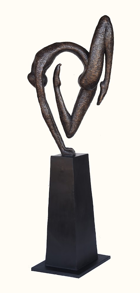 A bronze sculpture of intertwined abstract forms resting on a dark pedestal.
