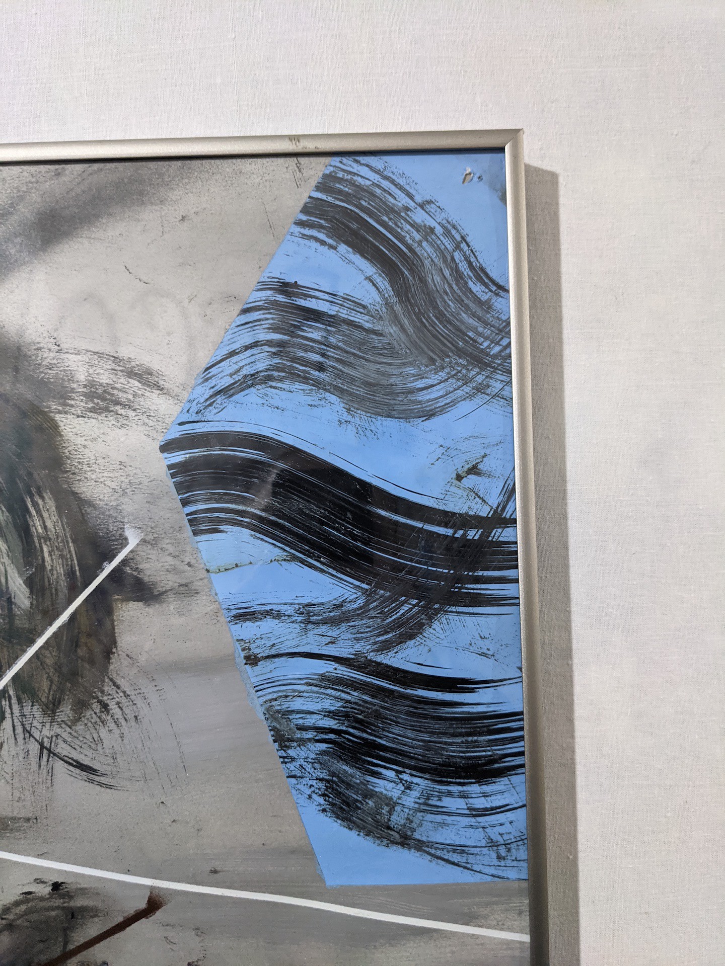 An abstract painting featuring a figure in distress with sharp geometric lines and a muted color palette.