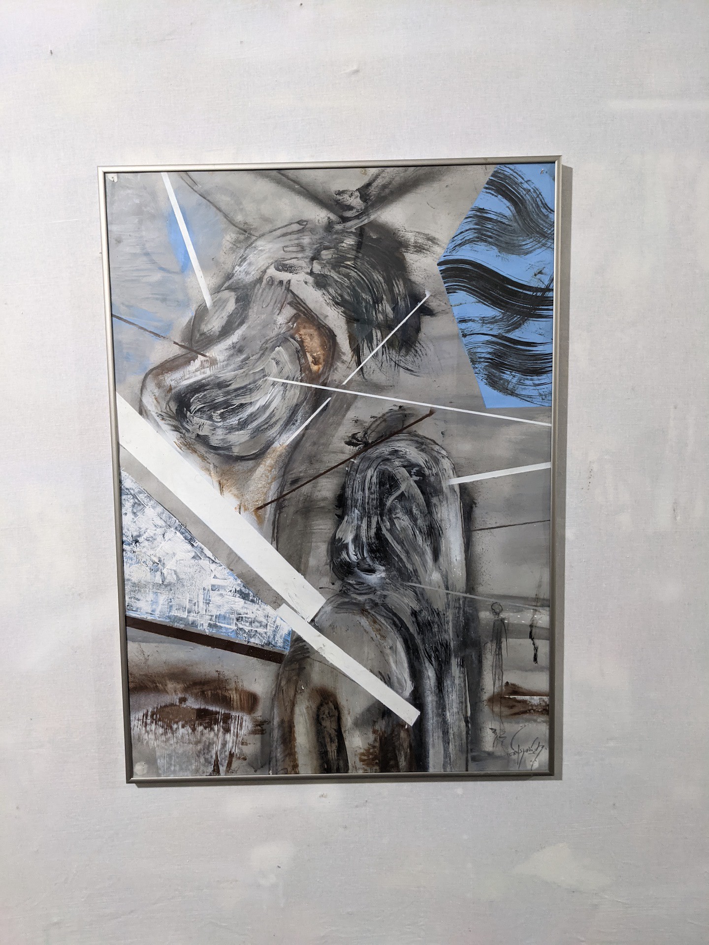 An abstract painting featuring a figure in distress with sharp geometric lines and a muted color palette.