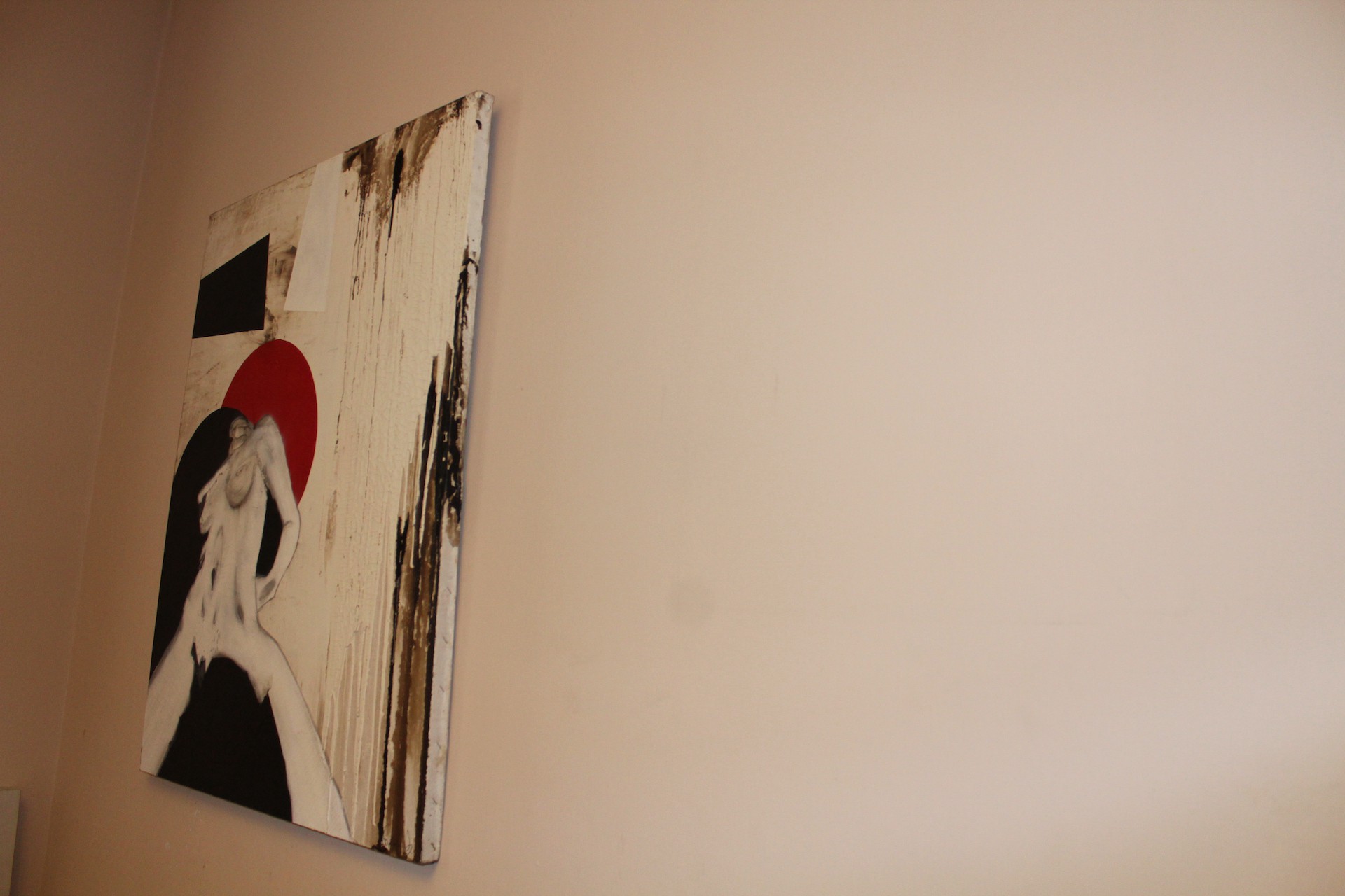 A painting hanging on a wall in a room.