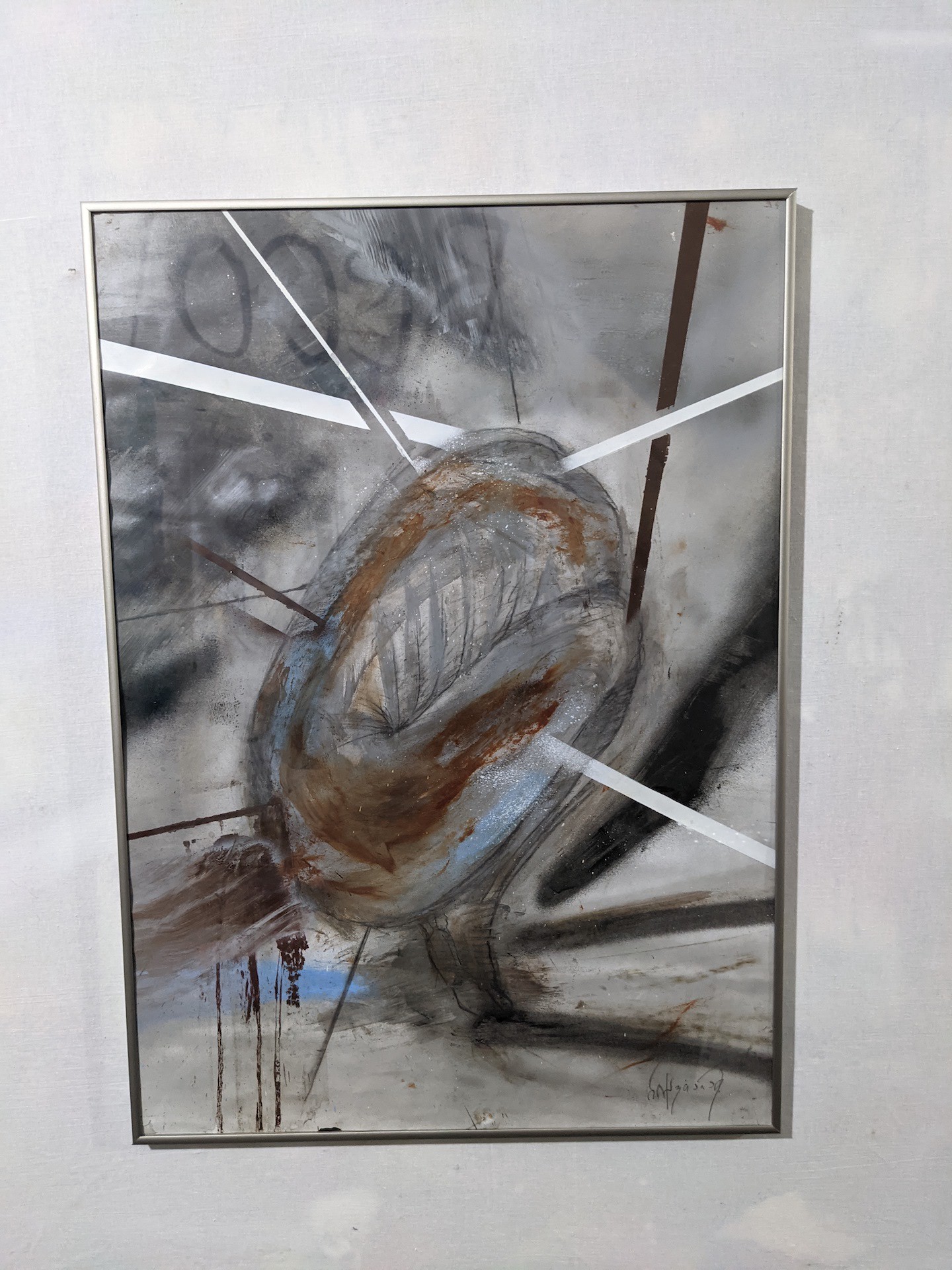 An abstract composition of layered horizontal bands in earthy tones.