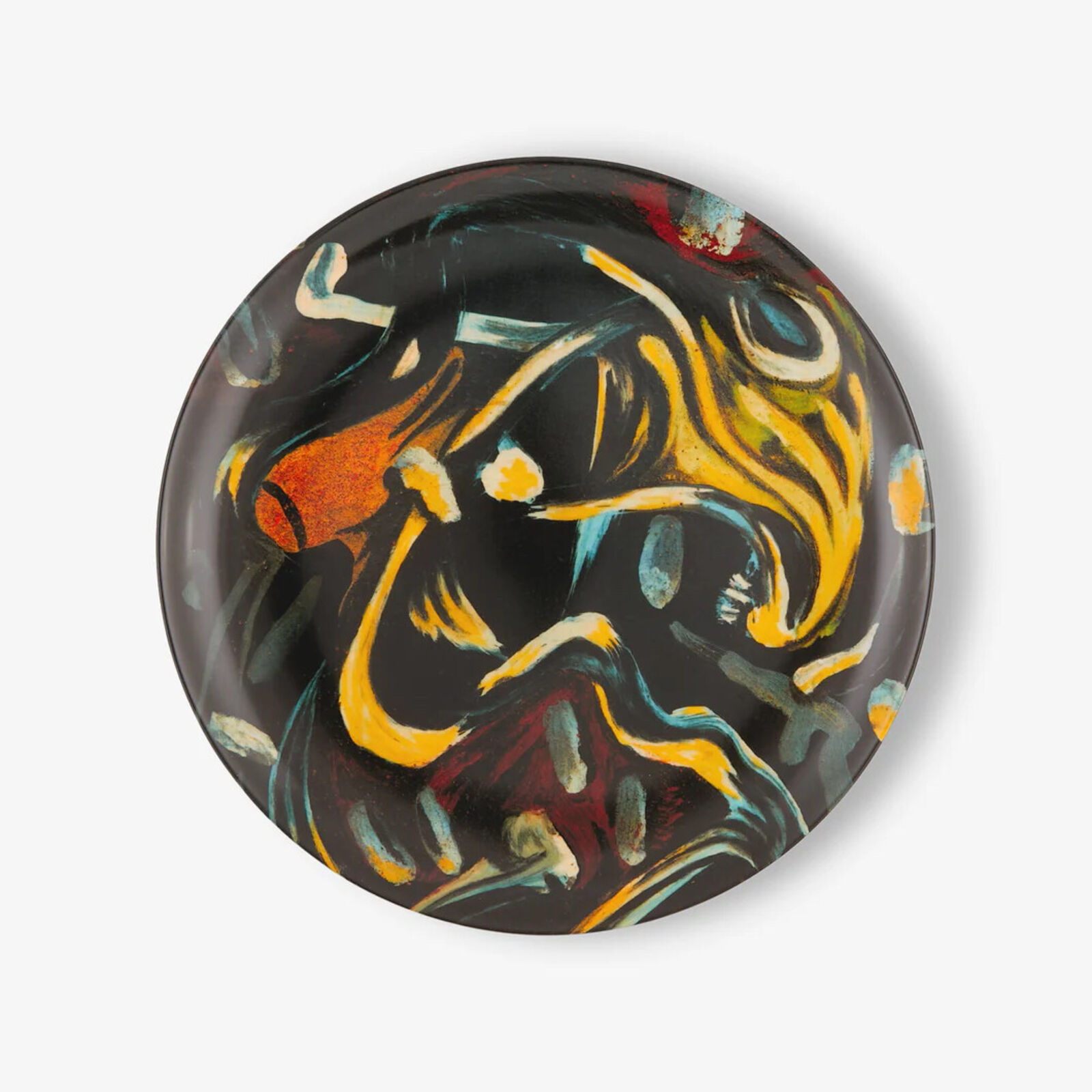 a black and yellow plate with a painting on it