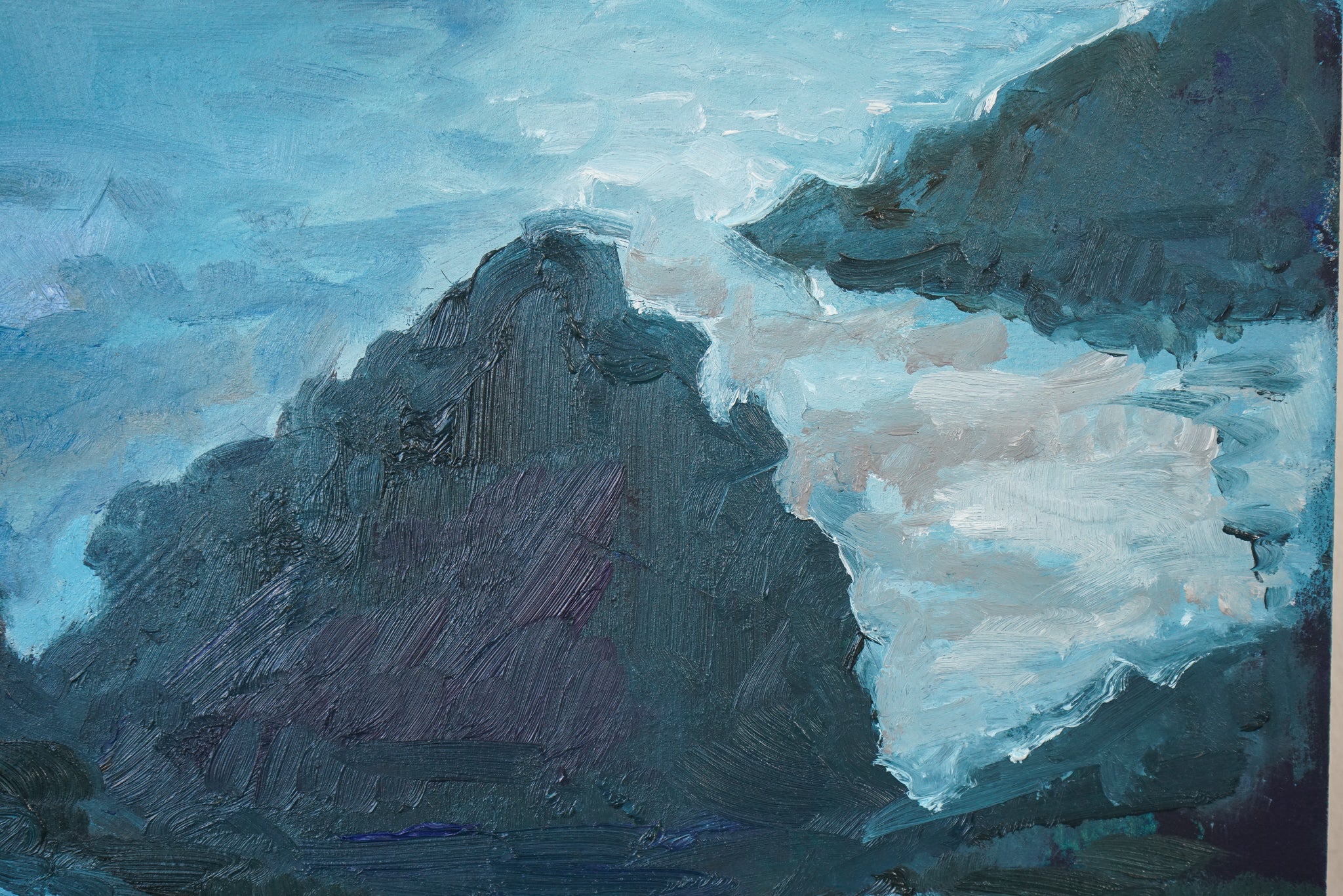 A painting of a rocky shoreline with waves crashing on the rocks.