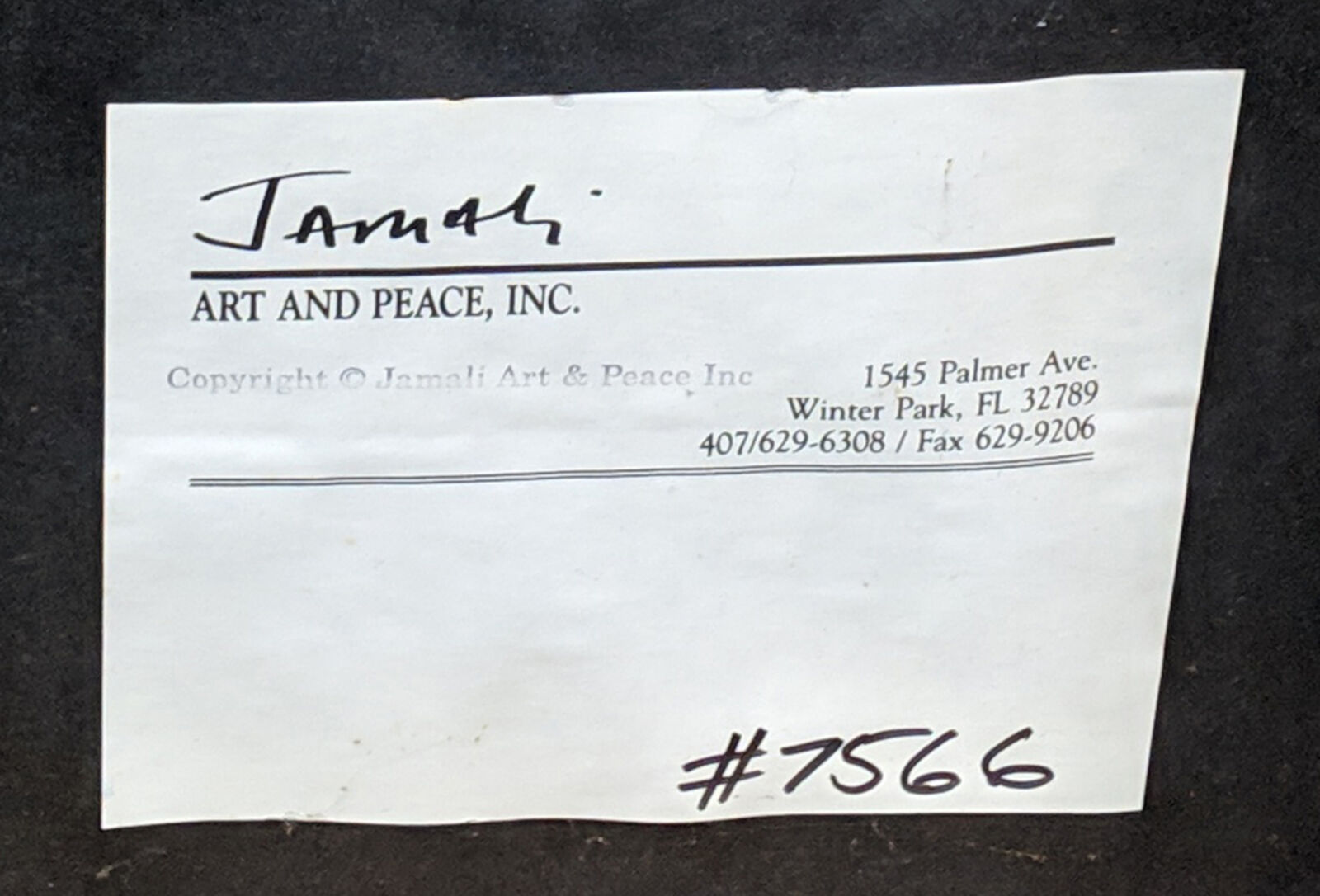 A close up of a face drawn on a wall.