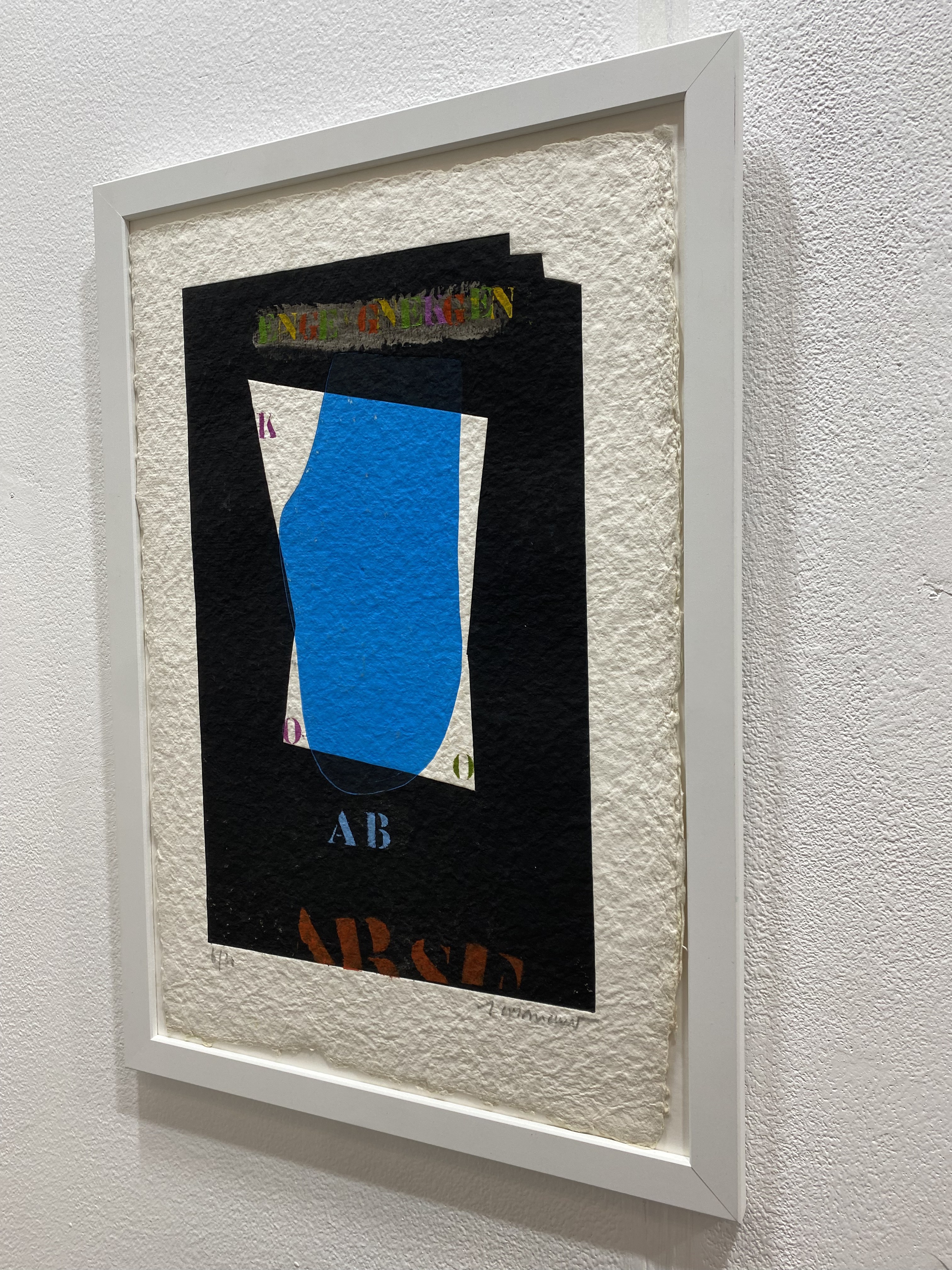 A layered collage featuring a bold blue shape against a dark background with colorful text elements.