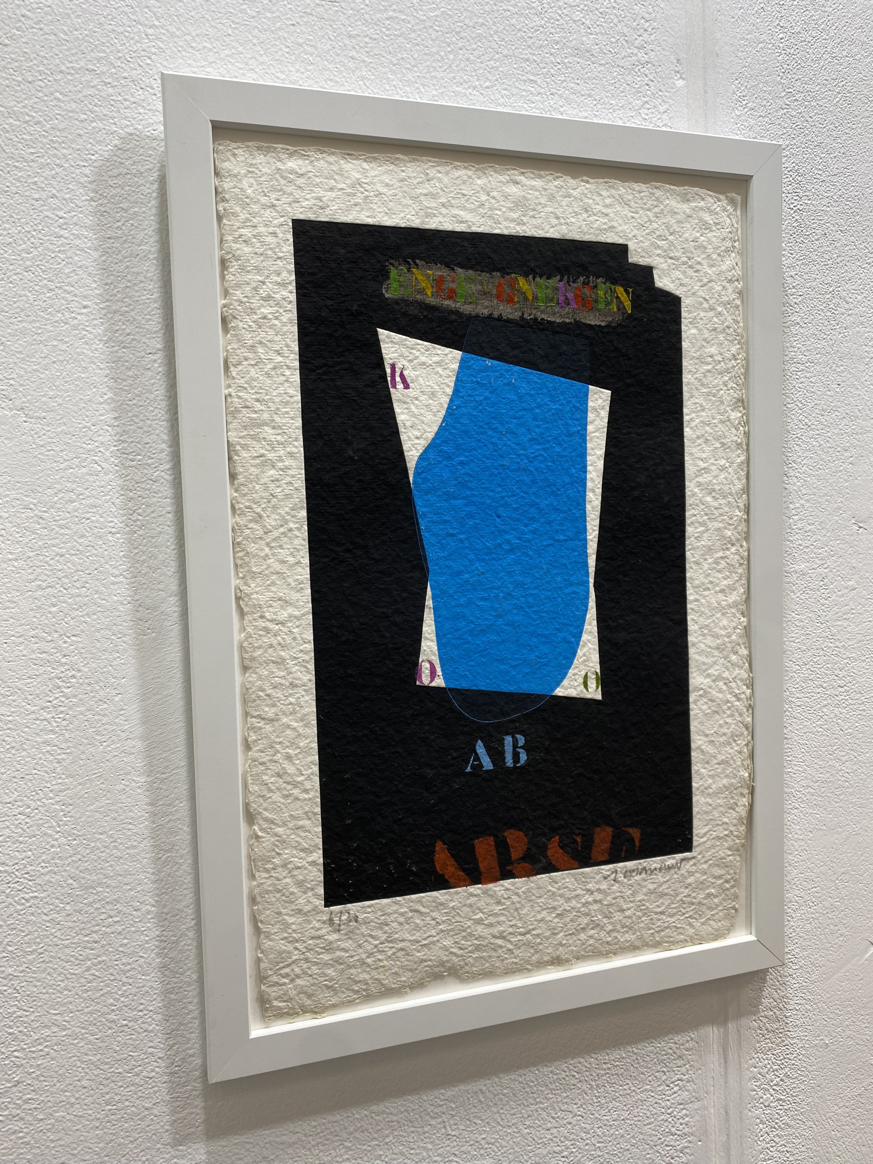 A layered collage featuring a bold blue shape against a dark background with colorful text elements.
