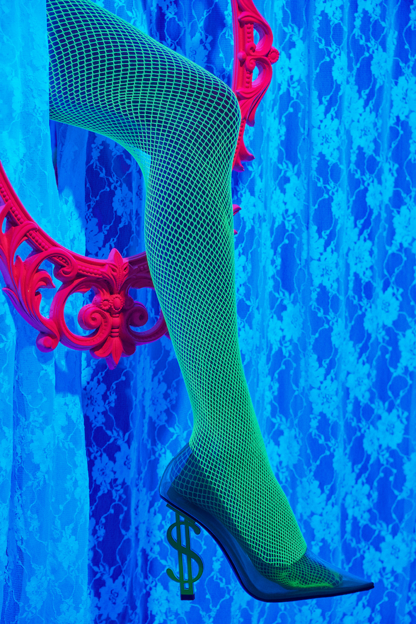 A pair of green fishnet stockings with a dollar sign on them.