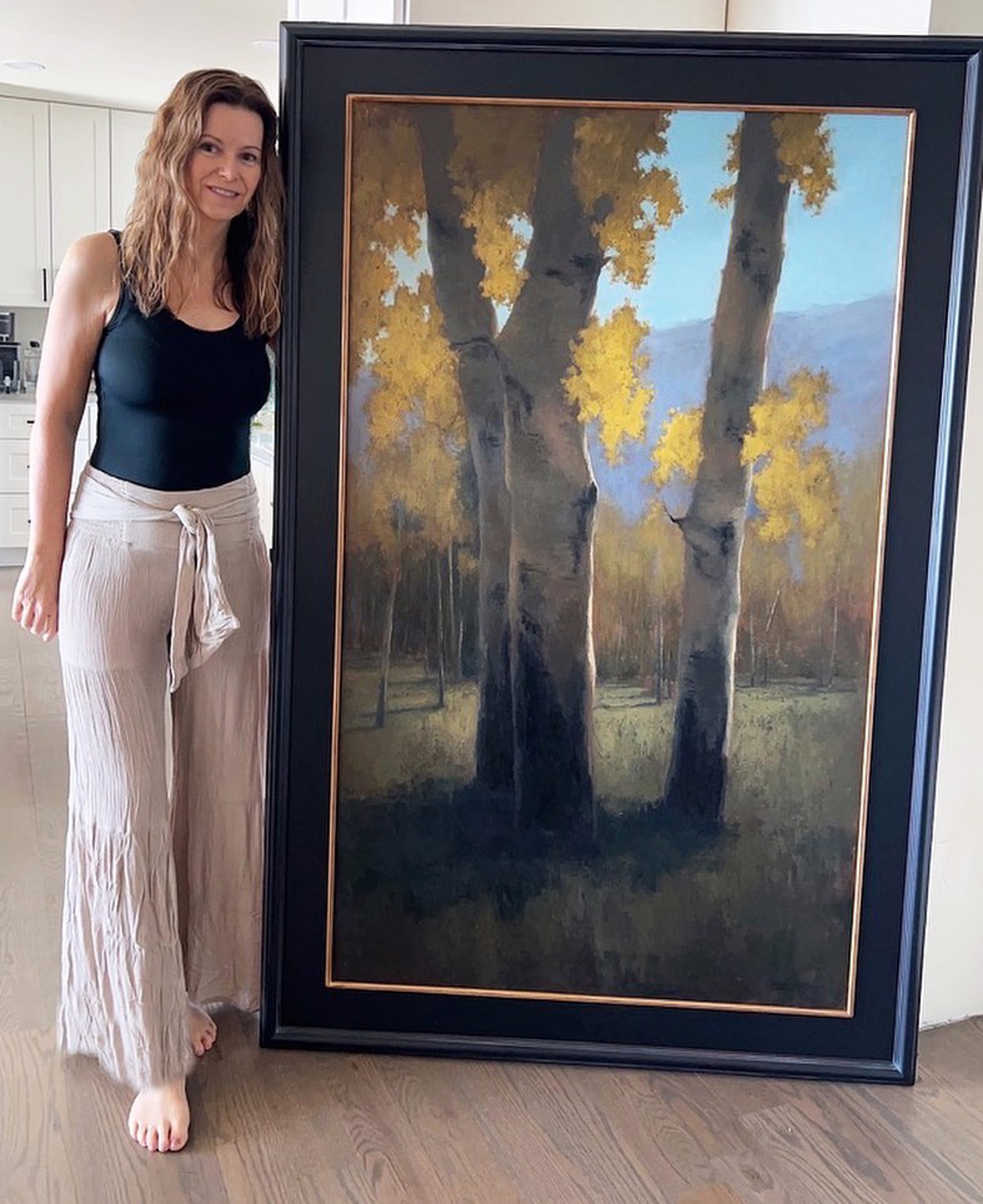 A painting of three aspen trees in a field with mountains in the background.