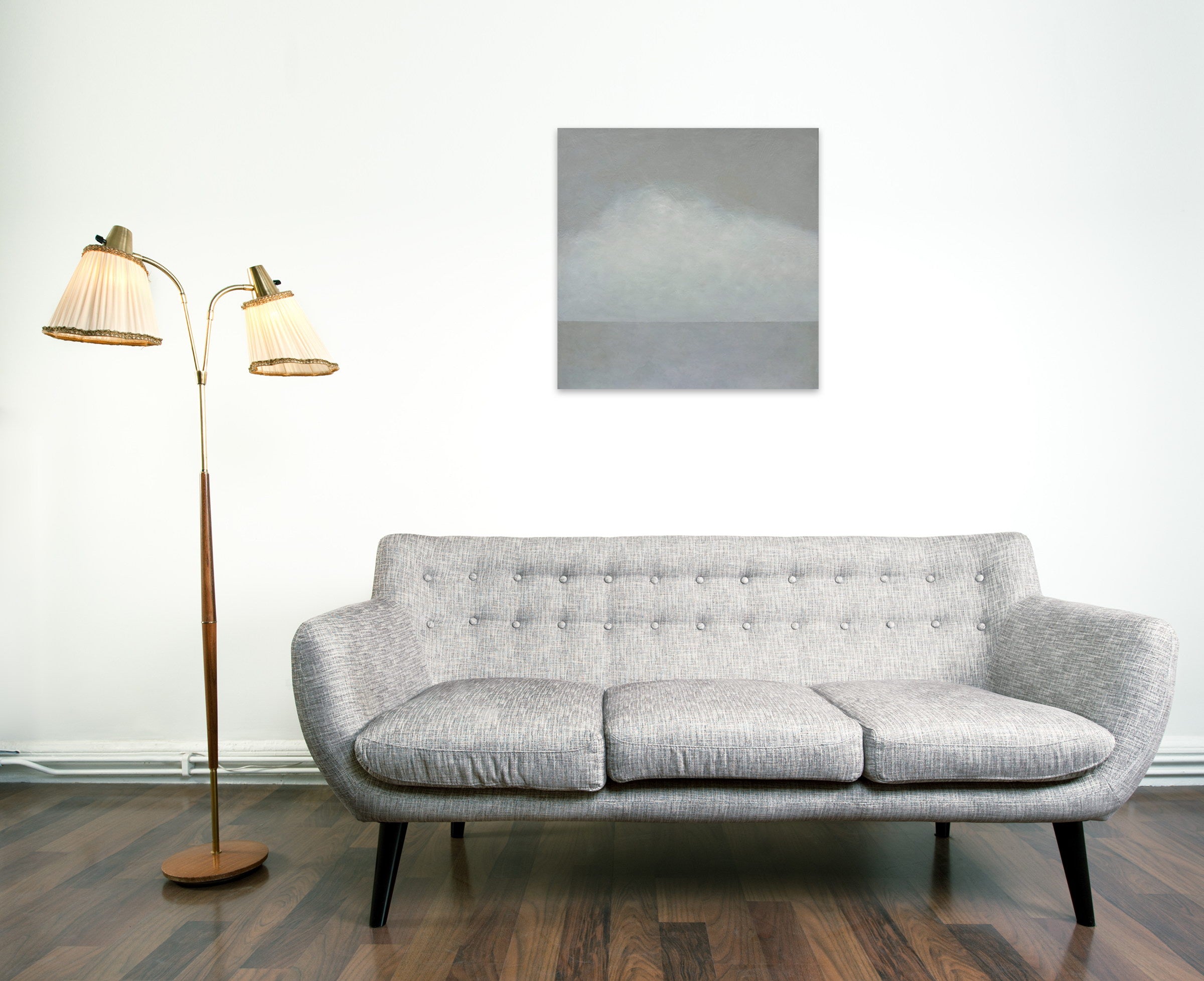 A painting of a cloudy sky over a body of water.