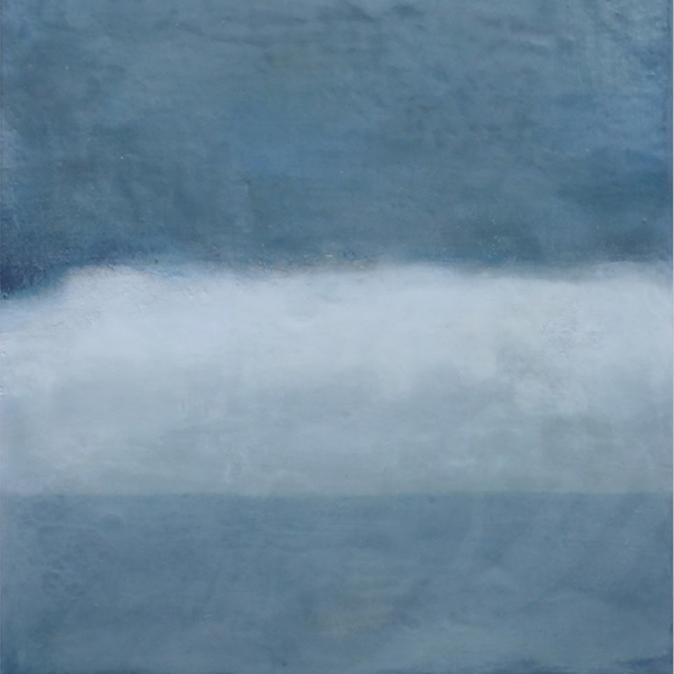 A pair of blue and white paintings on a white wall.