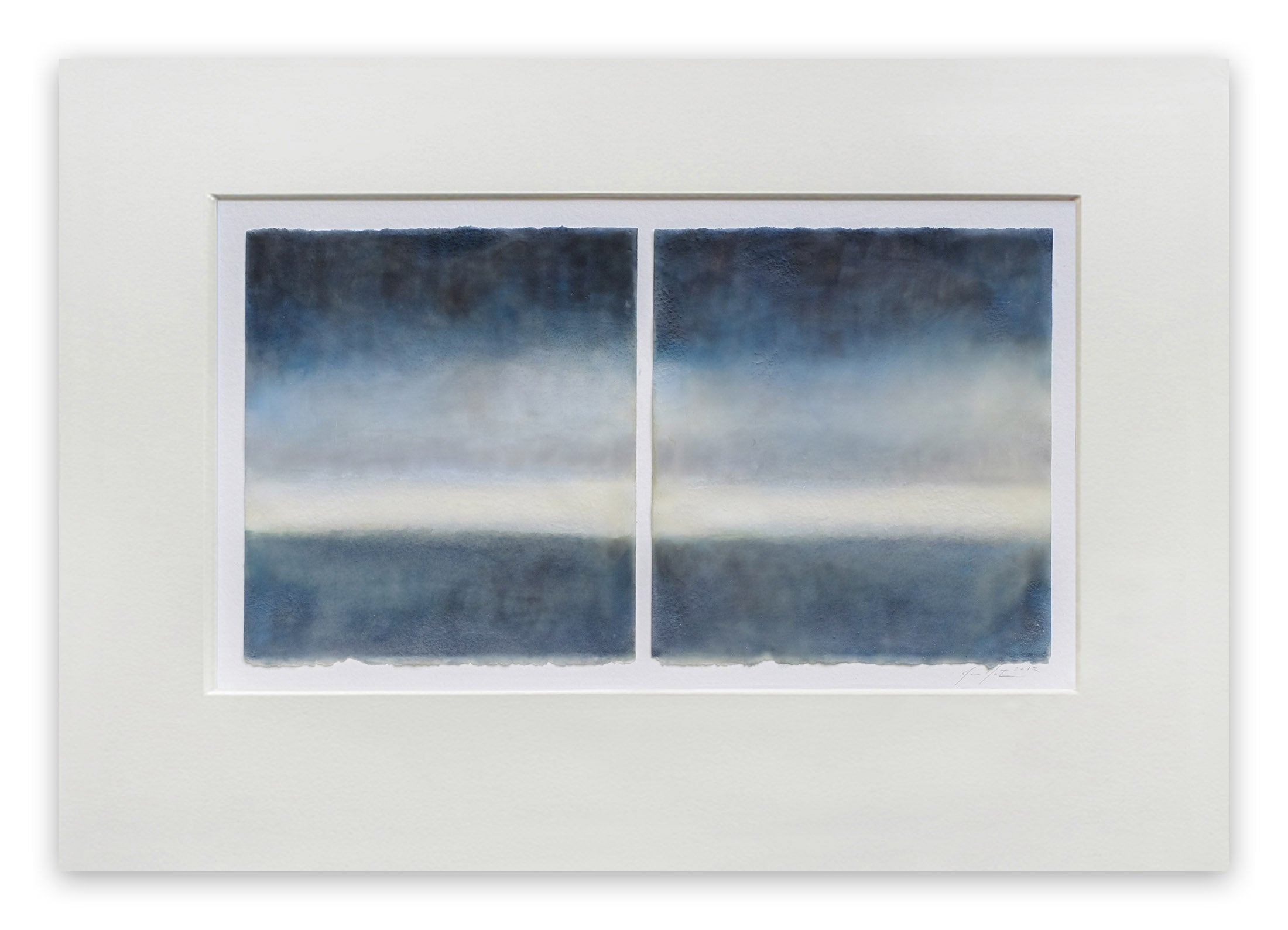 A painting of two blue and white paintings in a white frame.