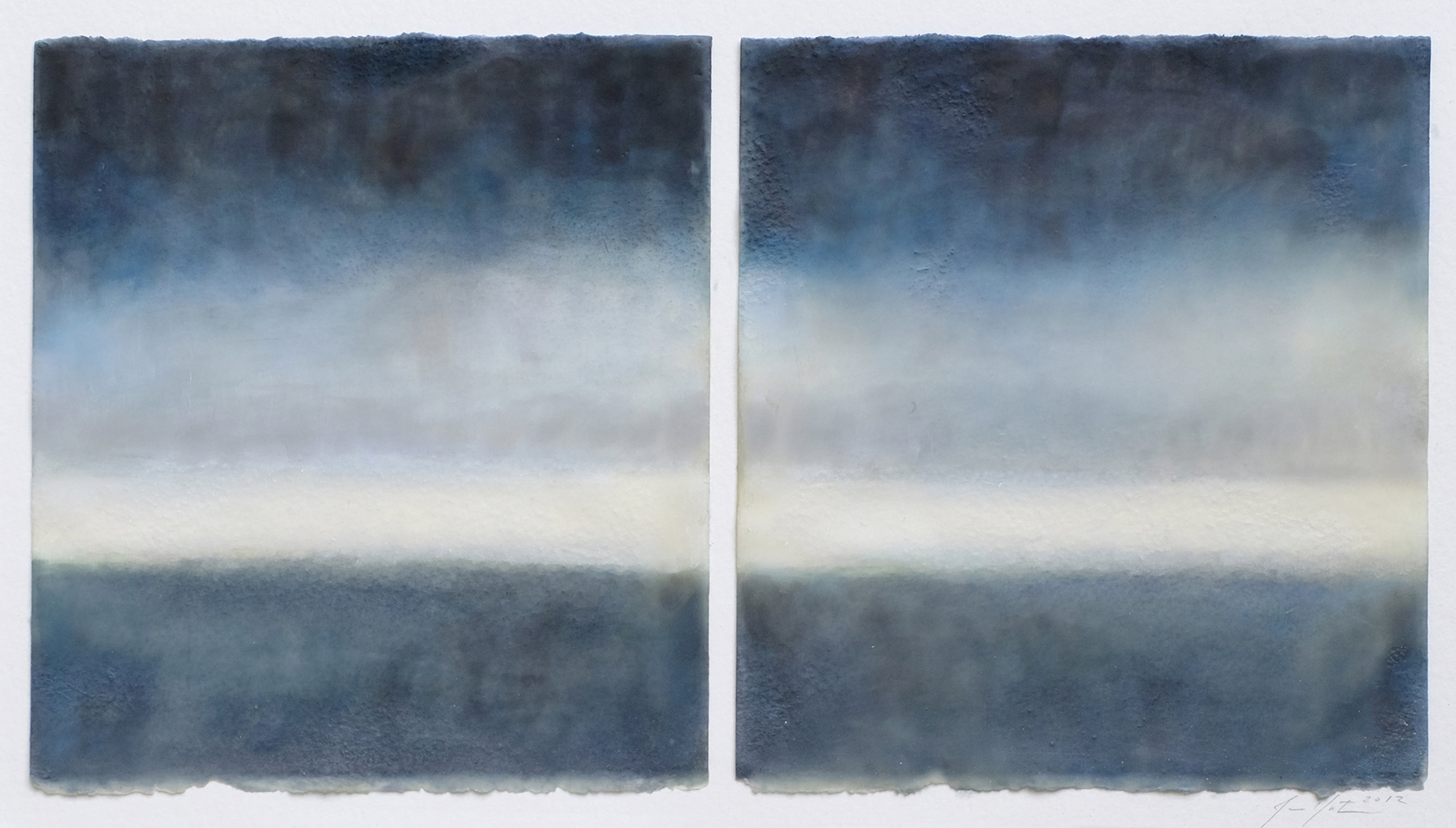 A painting of two blue and white paintings in a white frame.