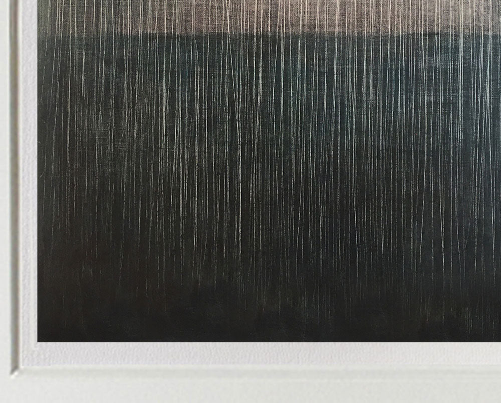 A picture of a black and white painting in a white frame.