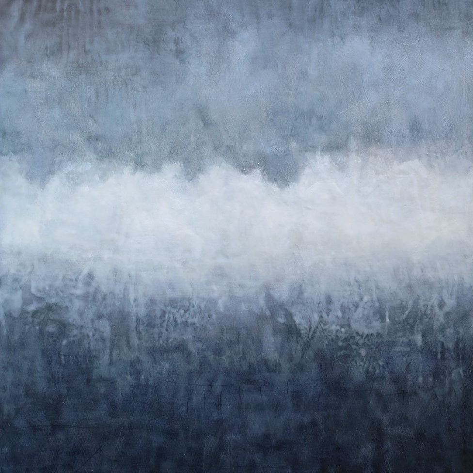 A pair of blue and white paintings on a white wall.