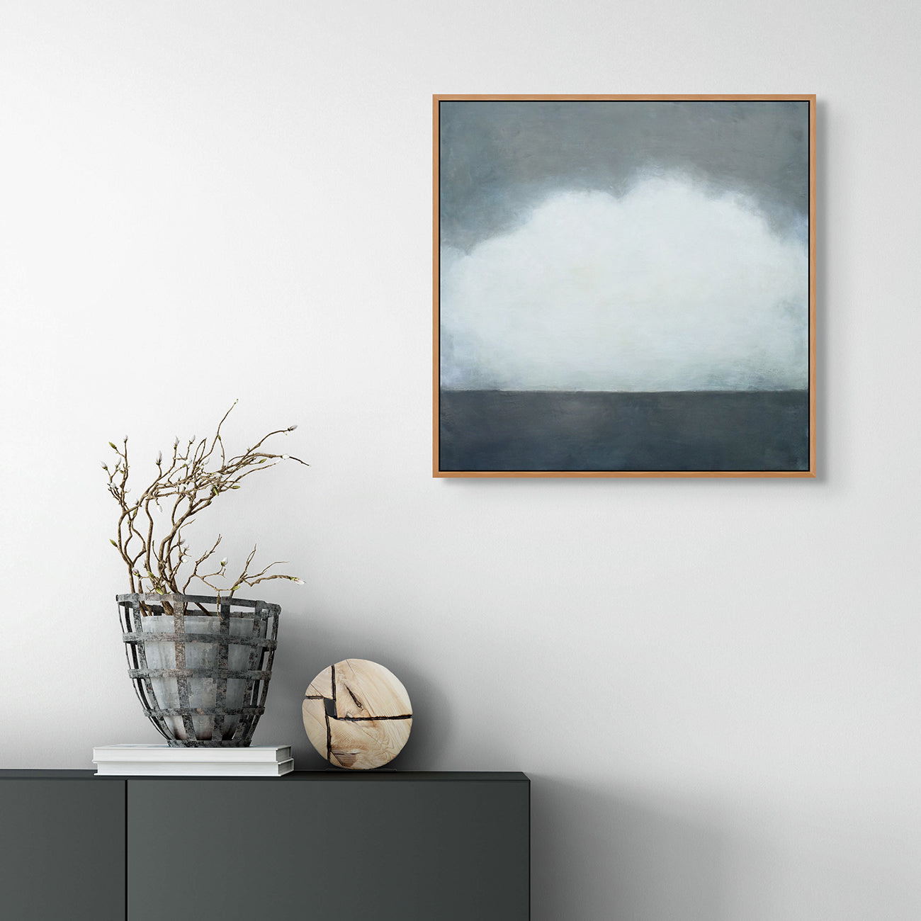 A painting of a cloudy sky over a body of water.