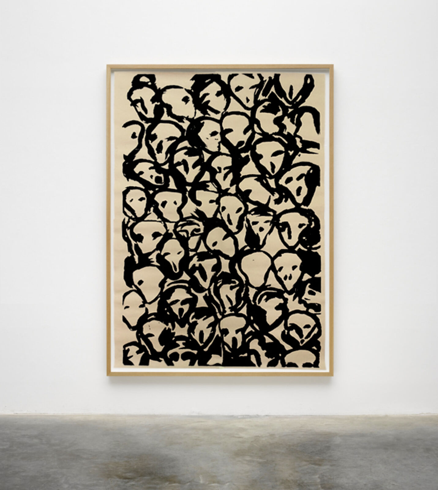 A black and white painting hanging on a wall in a room.