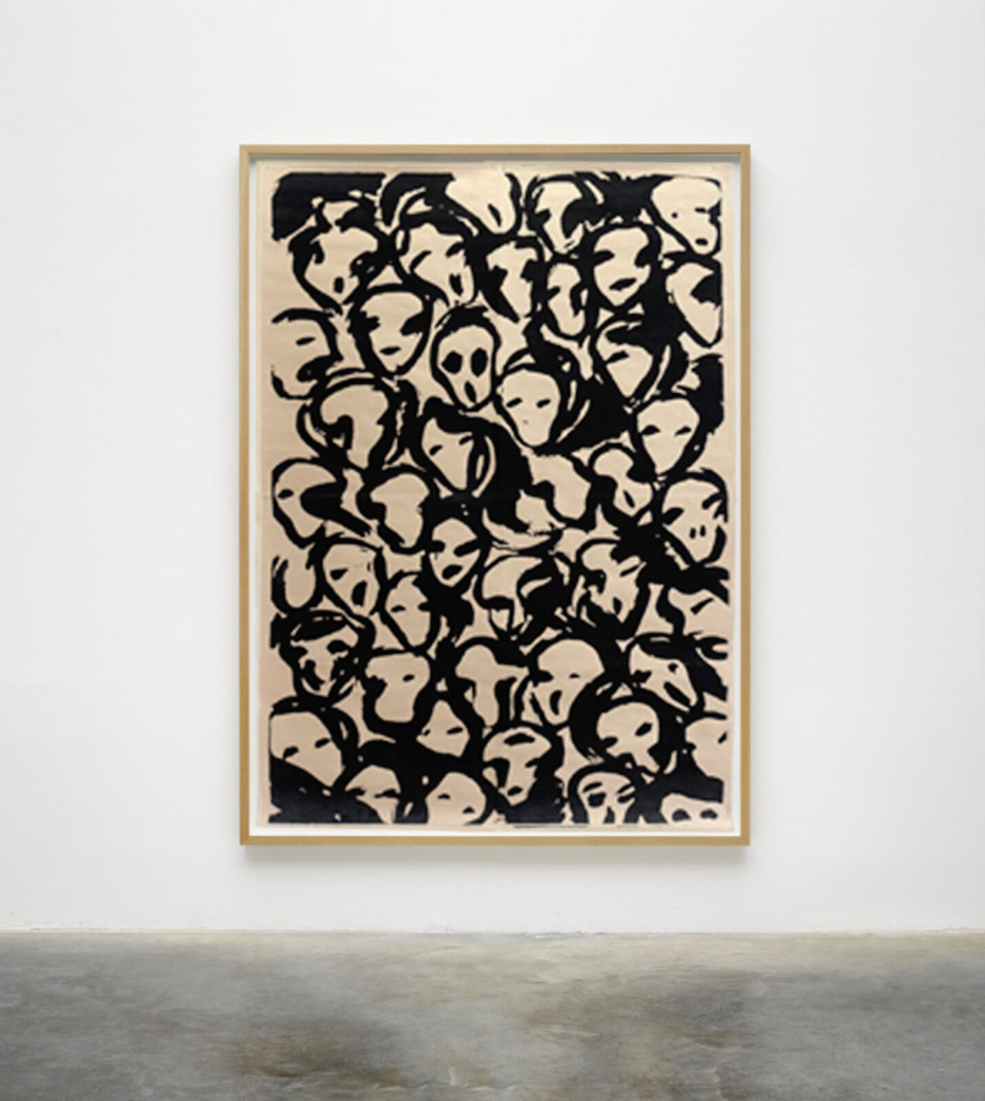 A black and white painting hanging on a wall in a room.