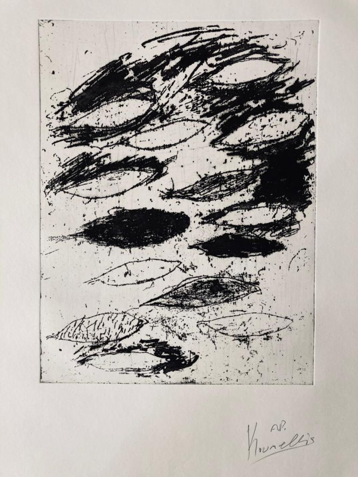 A black and white drawing of a face on a piece of paper.