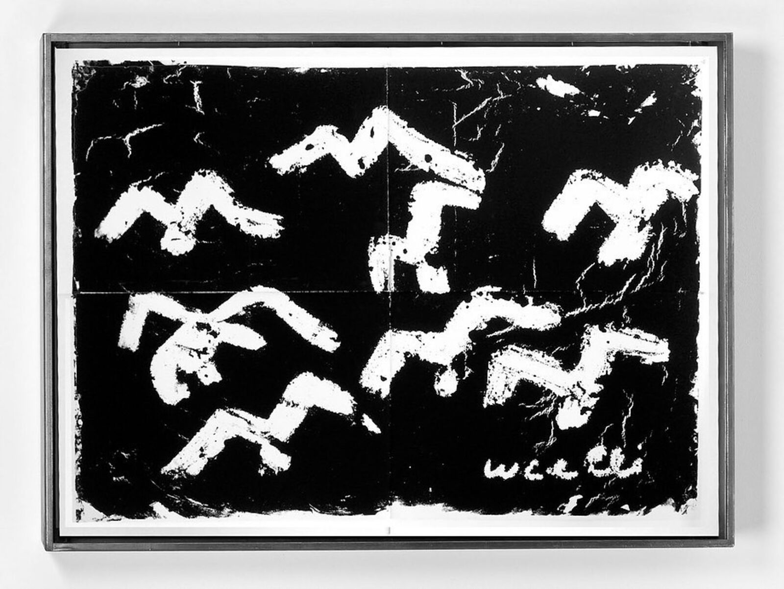 A black and white painting hanging on a wall.