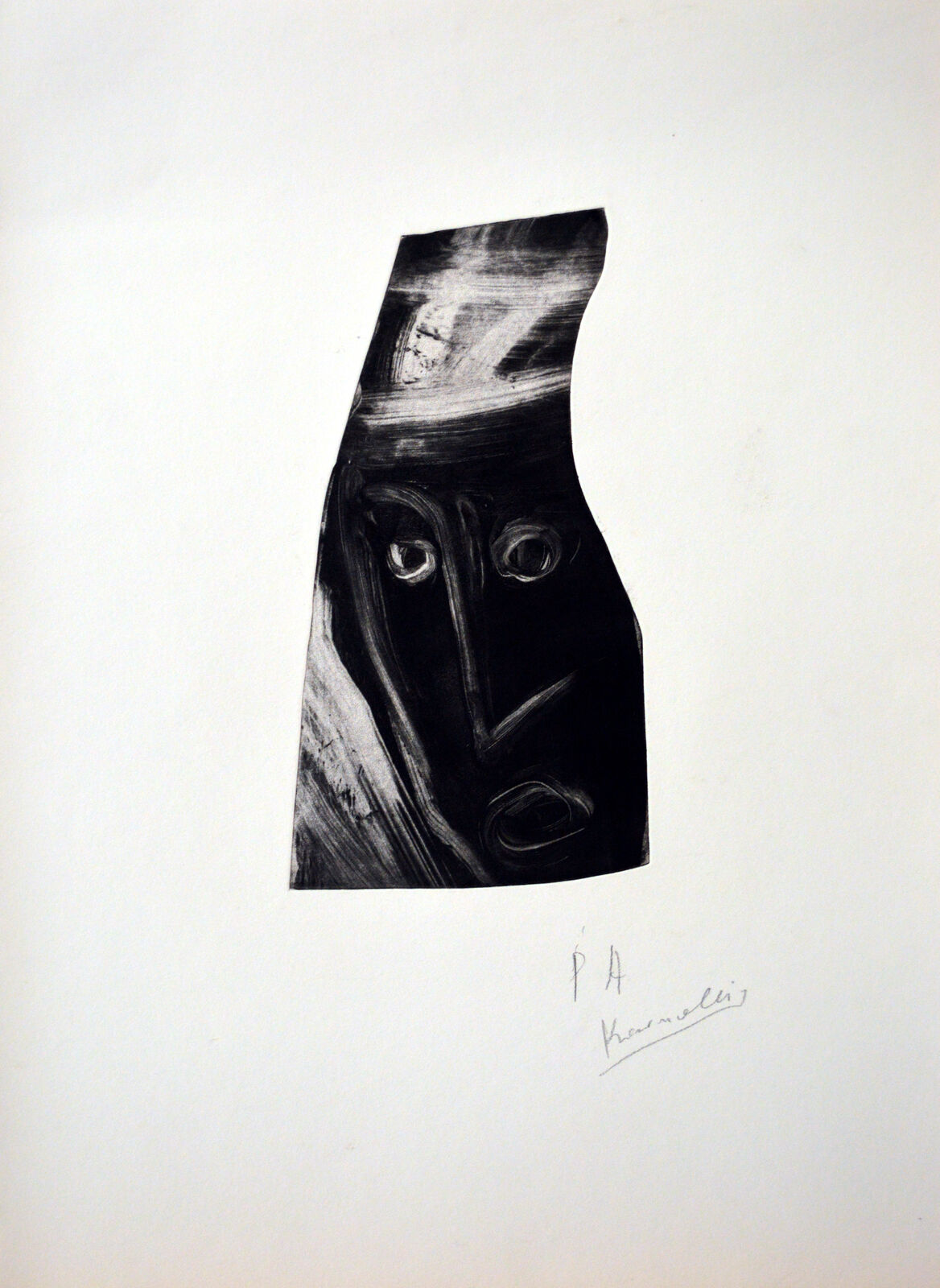 A black and white drawing of a face on a piece of paper.