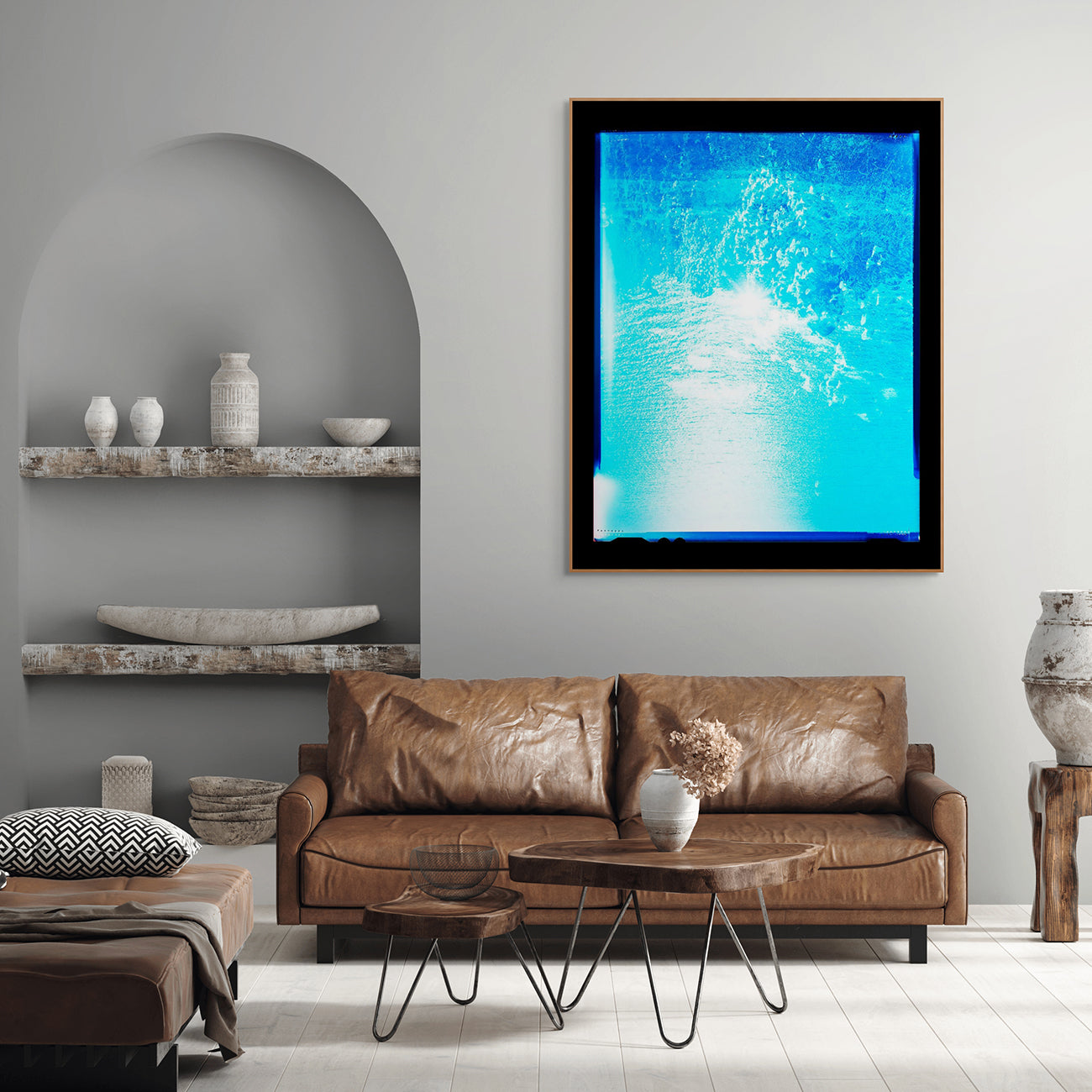A picture of a blue ocean with a black frame.