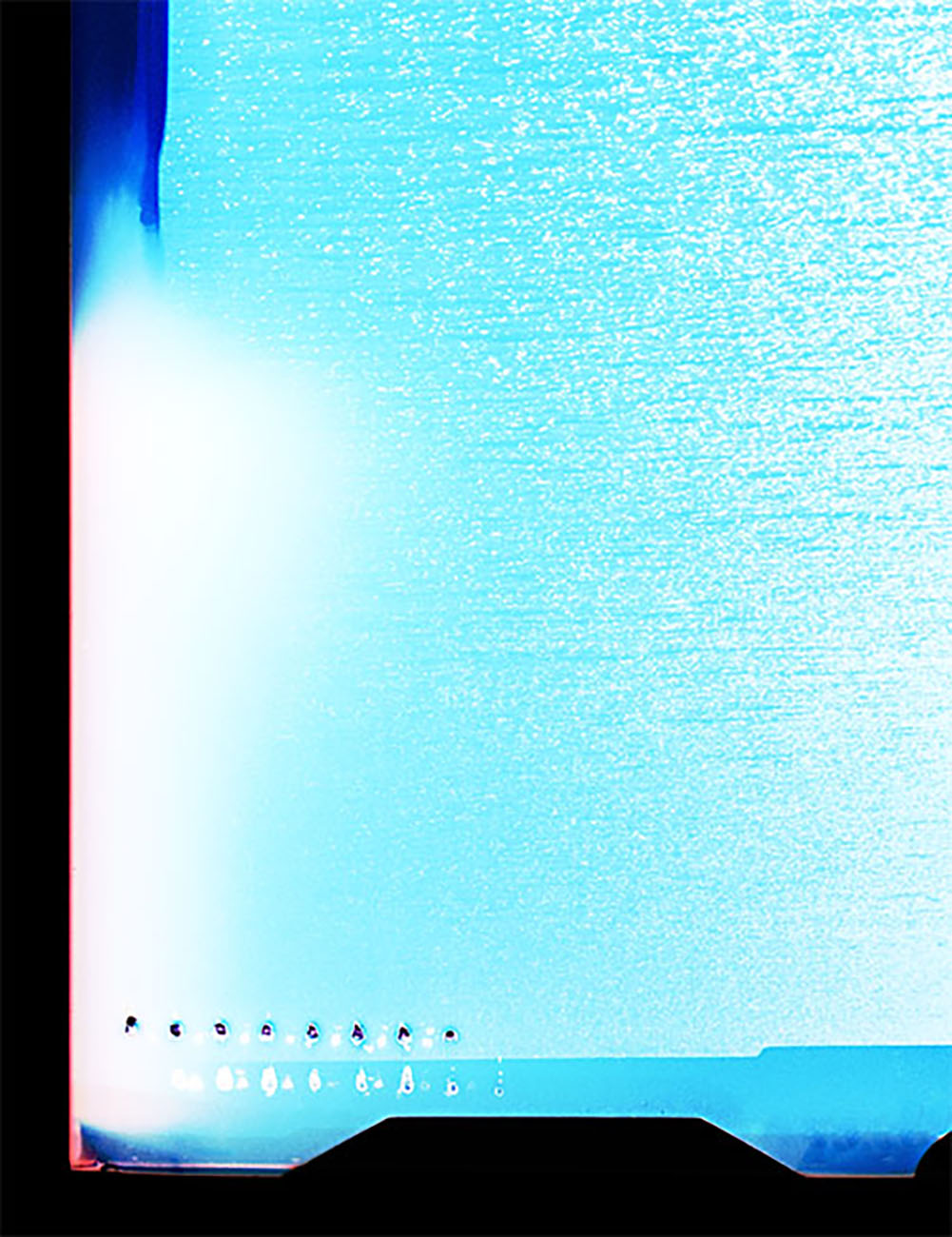 A picture of a blue ocean with a black frame.