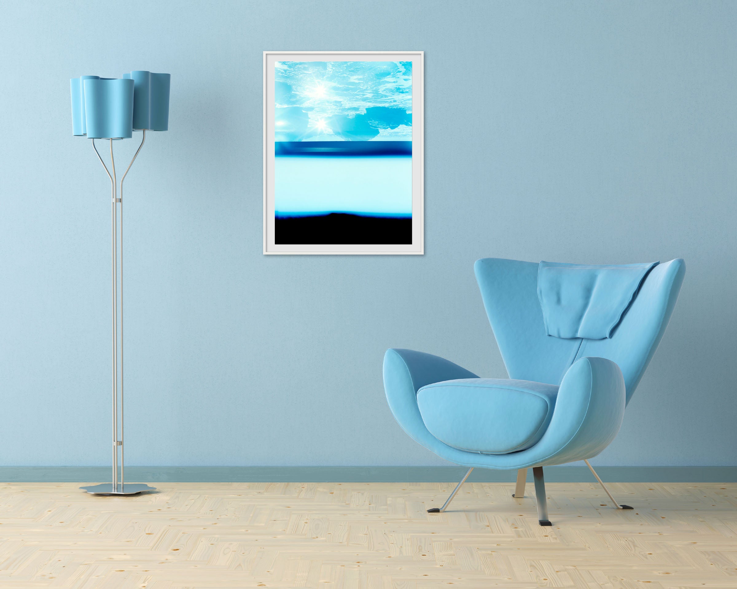 A picture of a blue ocean with the sun shining through the water.