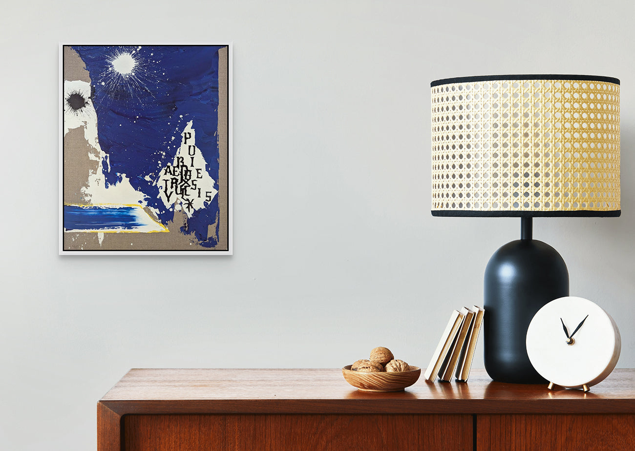 A blue and white painting with a sun in the background.