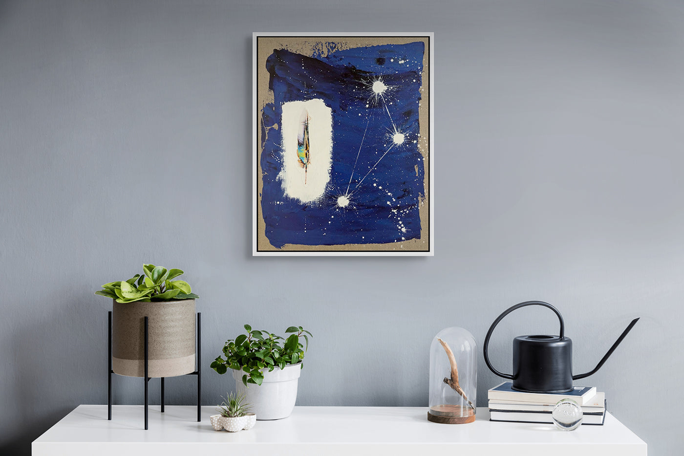 A painting of a feather on a blue background.