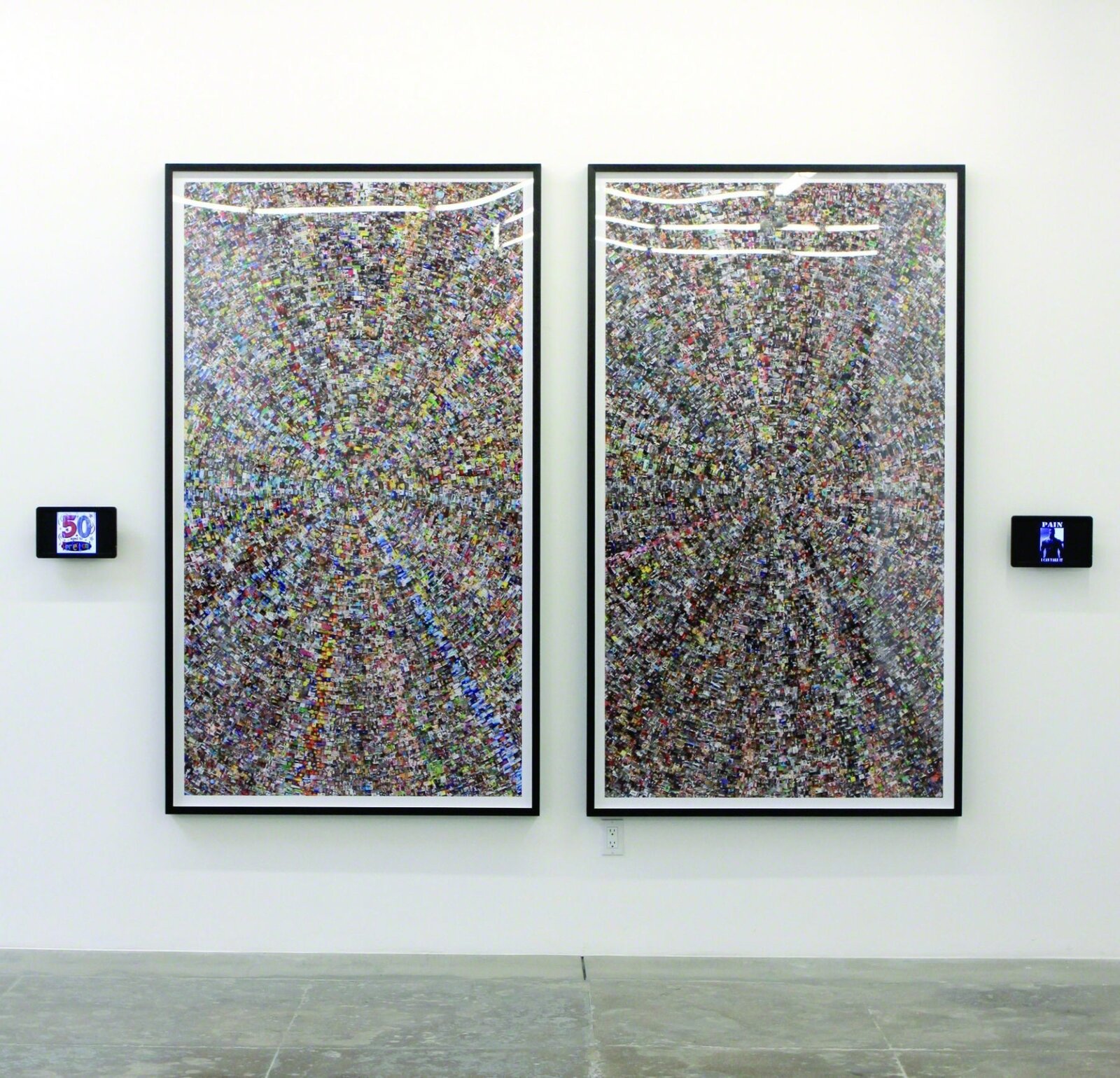 A gallery installation featuring two large framed collages of tiny images flanked by small digital displays.