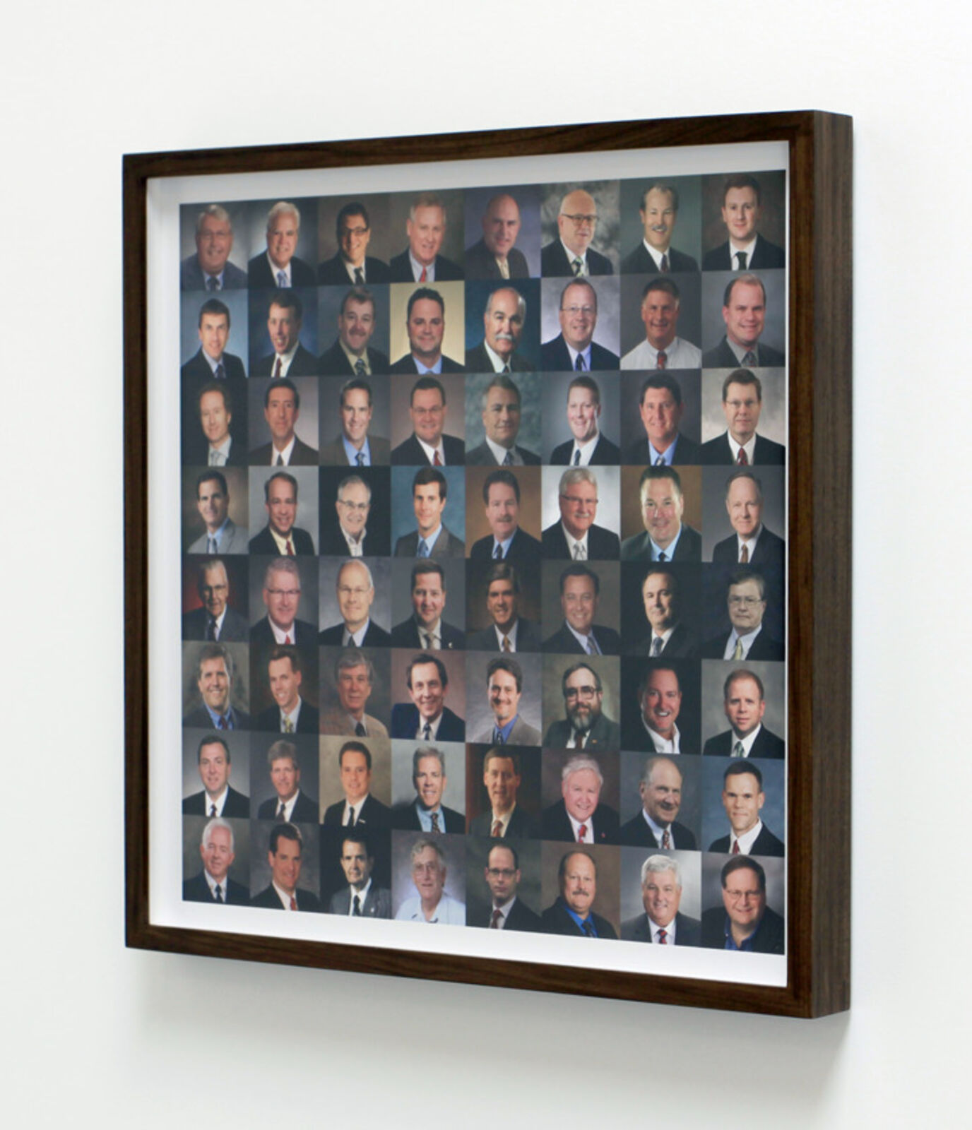 A grid of professional headshots featuring diverse individuals in formal attire.