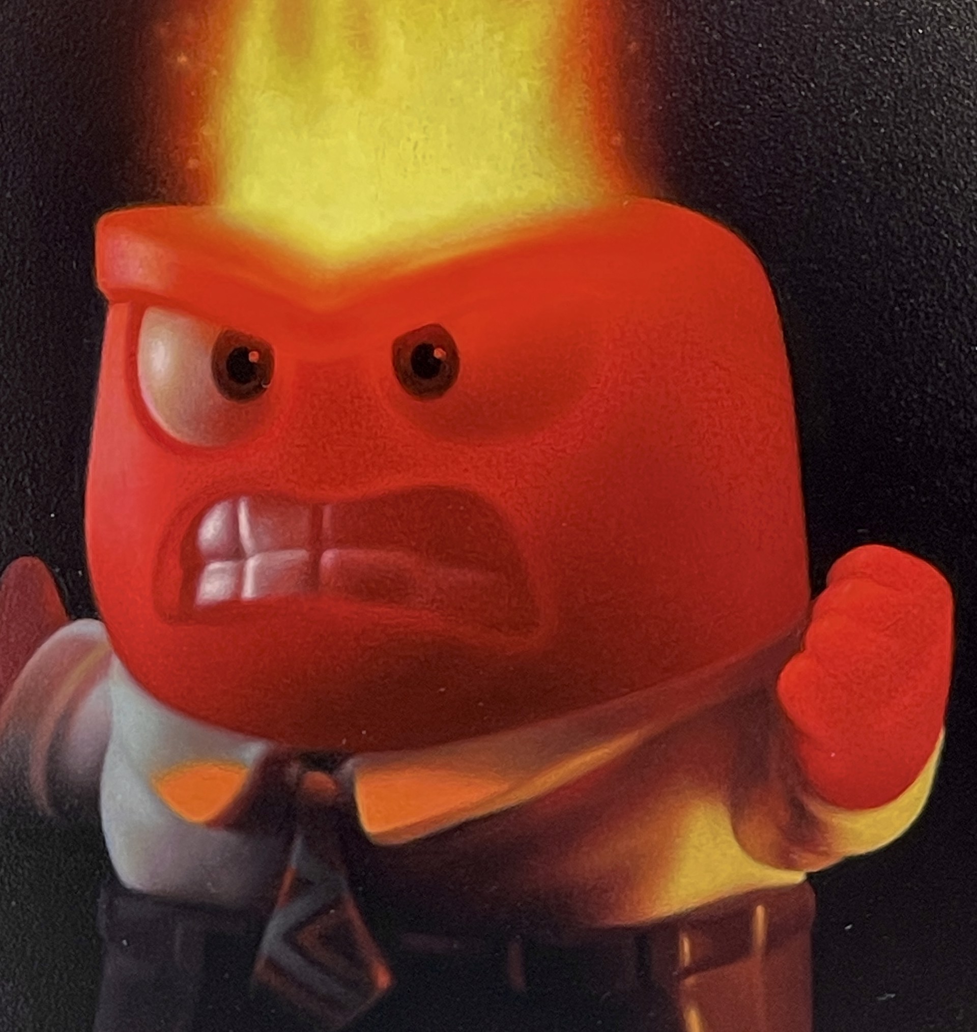 A man in a suit with a fire on his head.