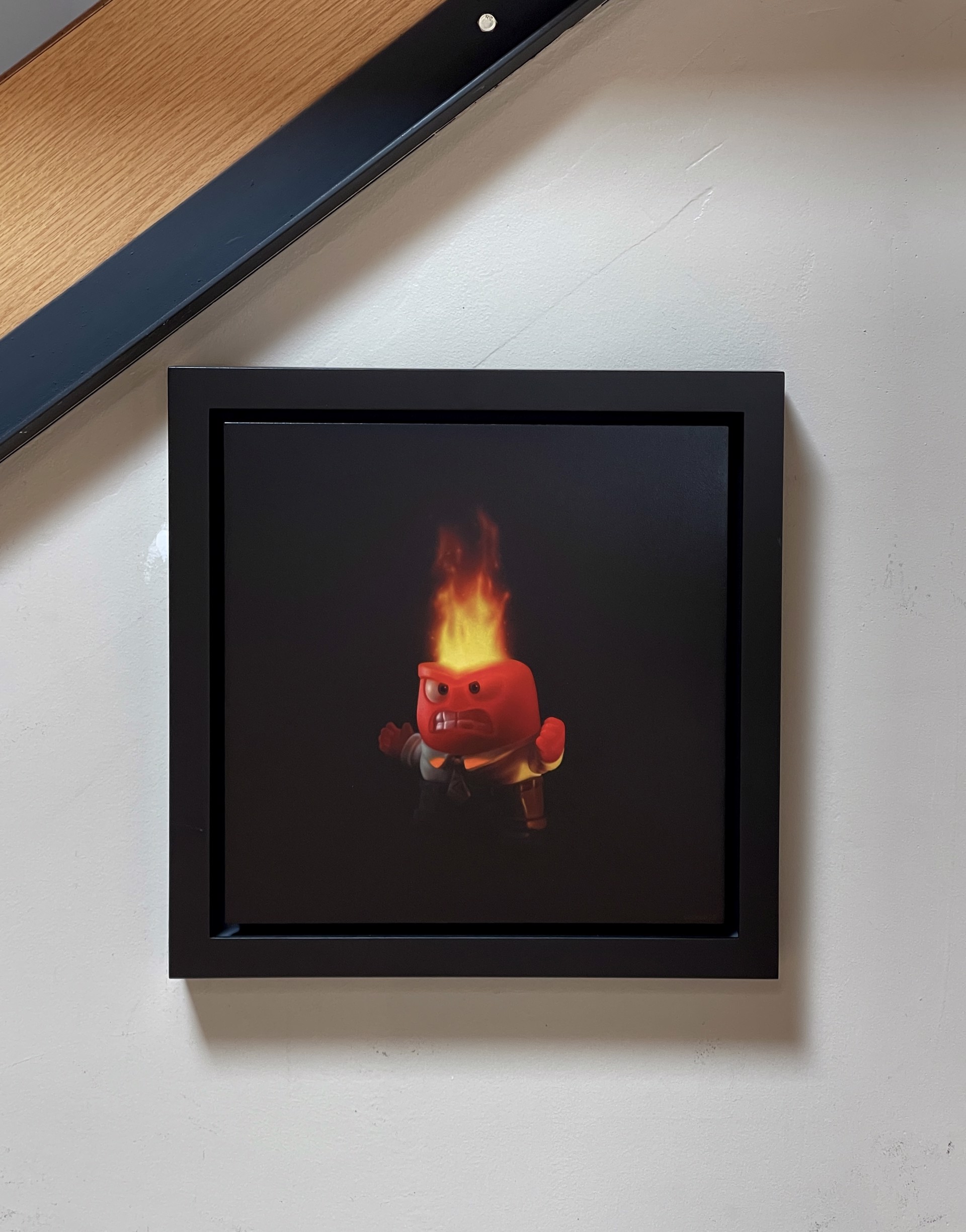 A man in a suit with a fire on his head.