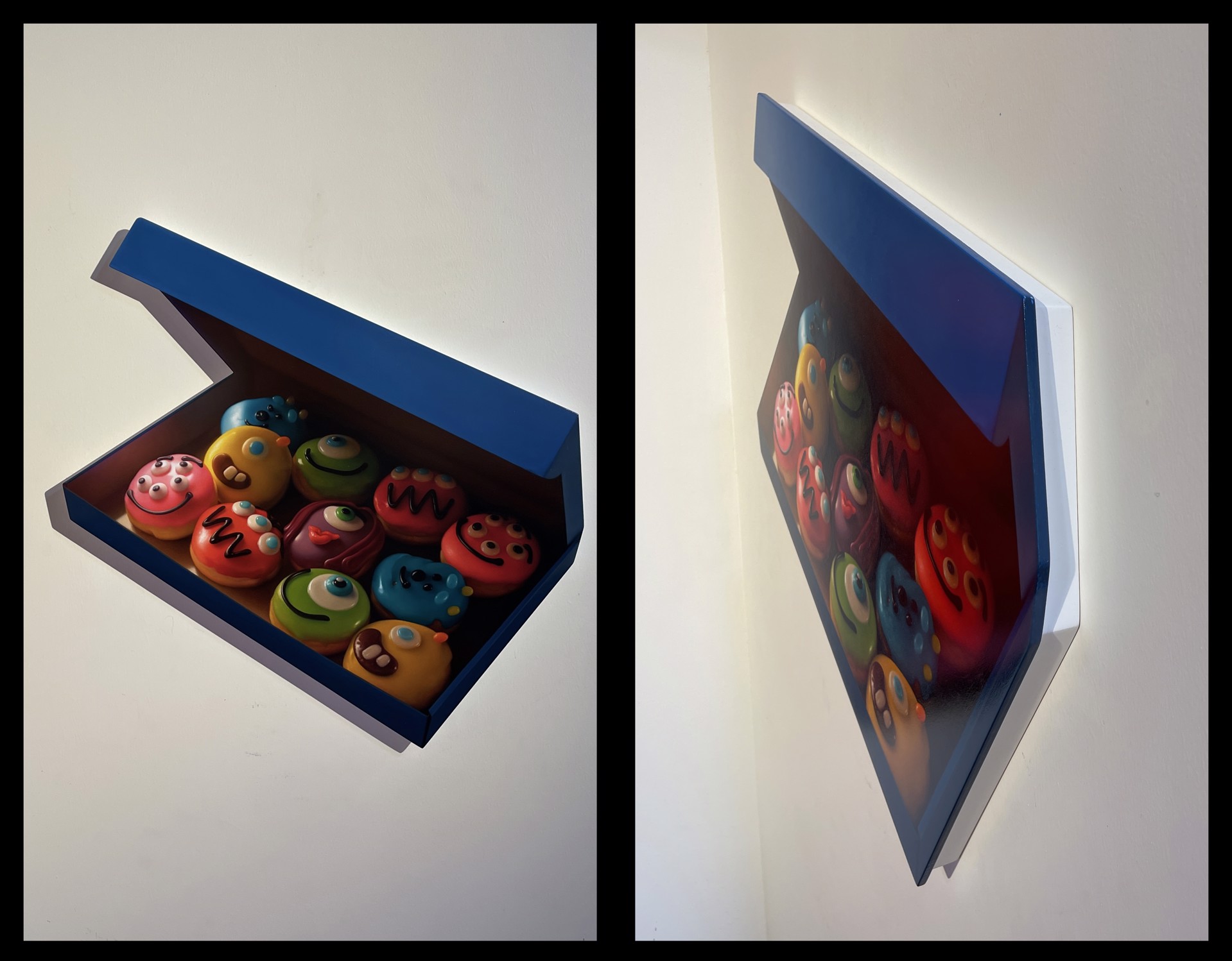 A blue box filled with lots of colorful donuts in it.